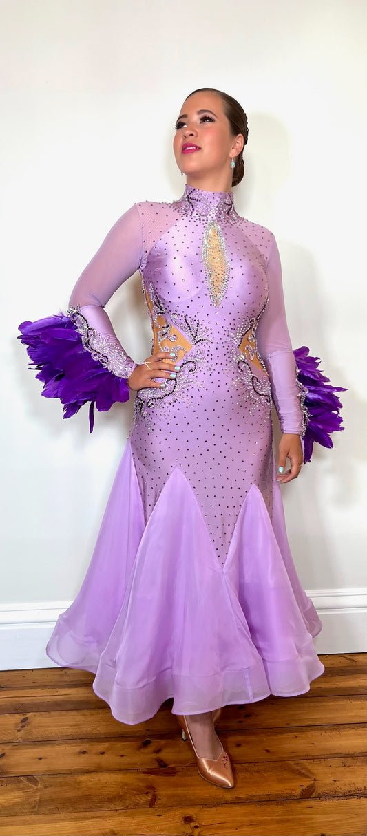 323 Lilac & Purple Ballroom Dress with separate Feather cuff detail. High neck with keyhole back. Decorated with purple, lilac stones and motifs. Detachable sleeve cuff detail.