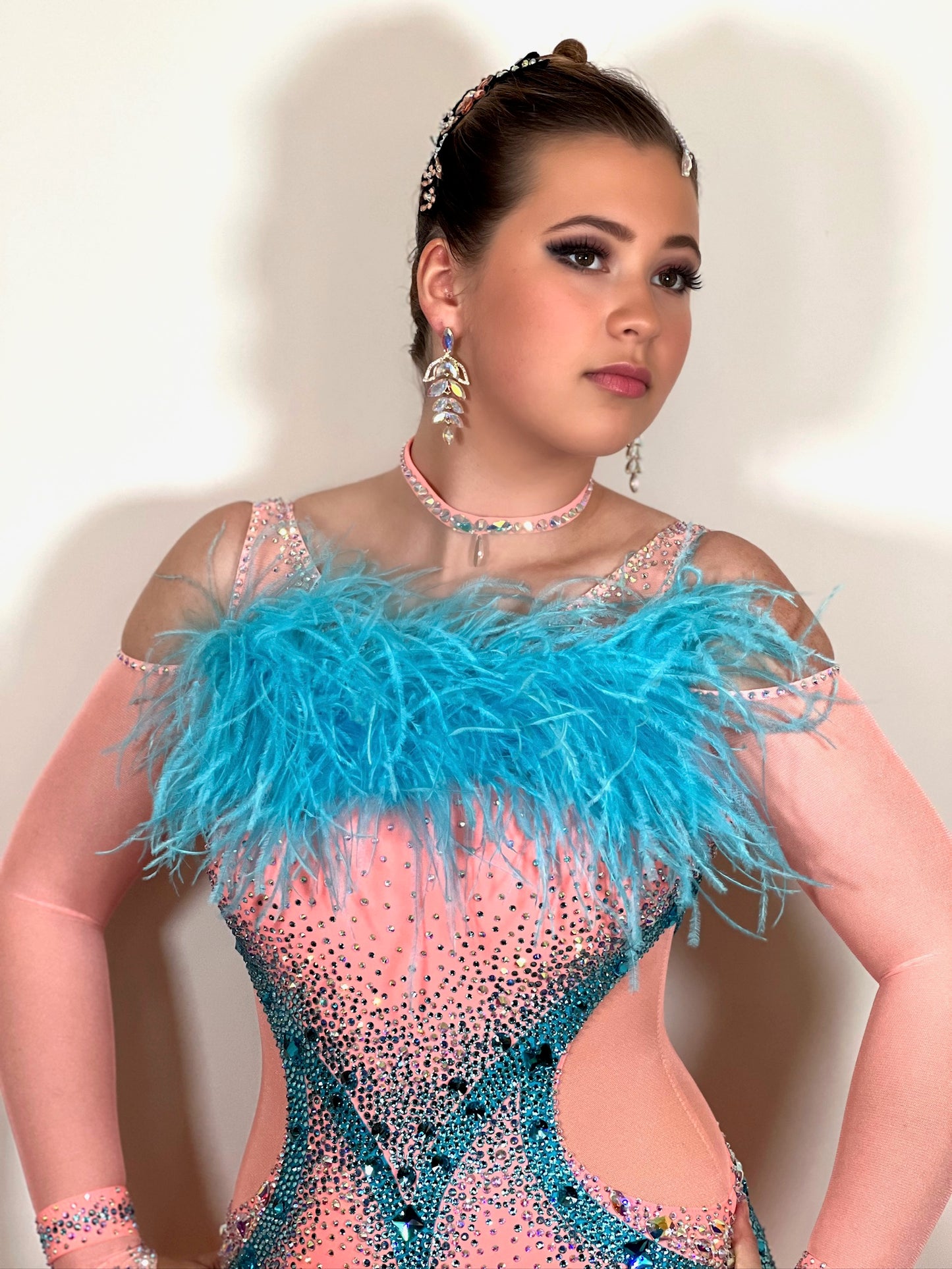 0111 Peach & Paradise Blue Competition Ballroom Dance Dress. Ostrich feather boa floats & detail to  the upper chest. Stunning stone decorations in paradise blue & AB