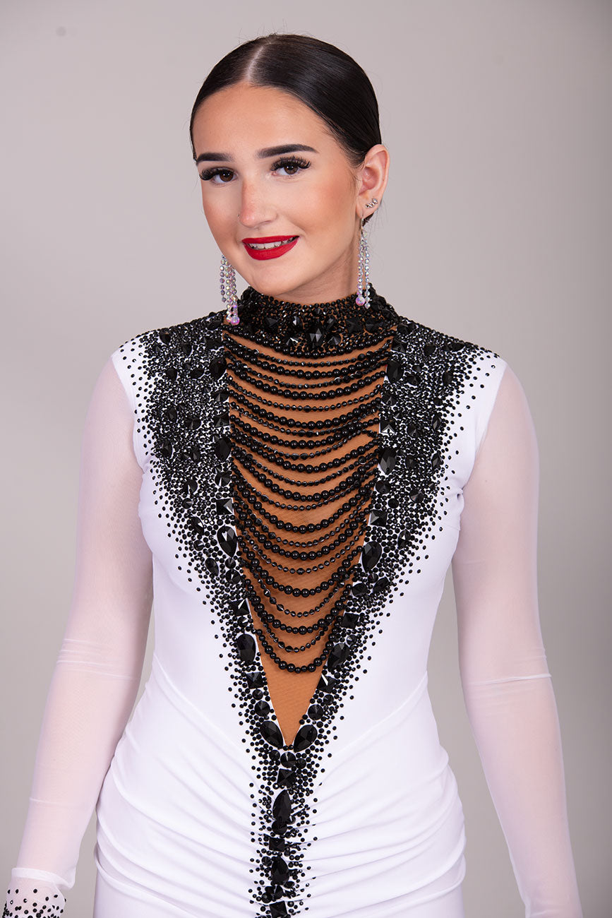 08L Stand Out Striking Competition Latin Dance Dress. Stunning Bodice detailing in Tan & Black. Deep collar with beading to the front. Ruched front with longer back.