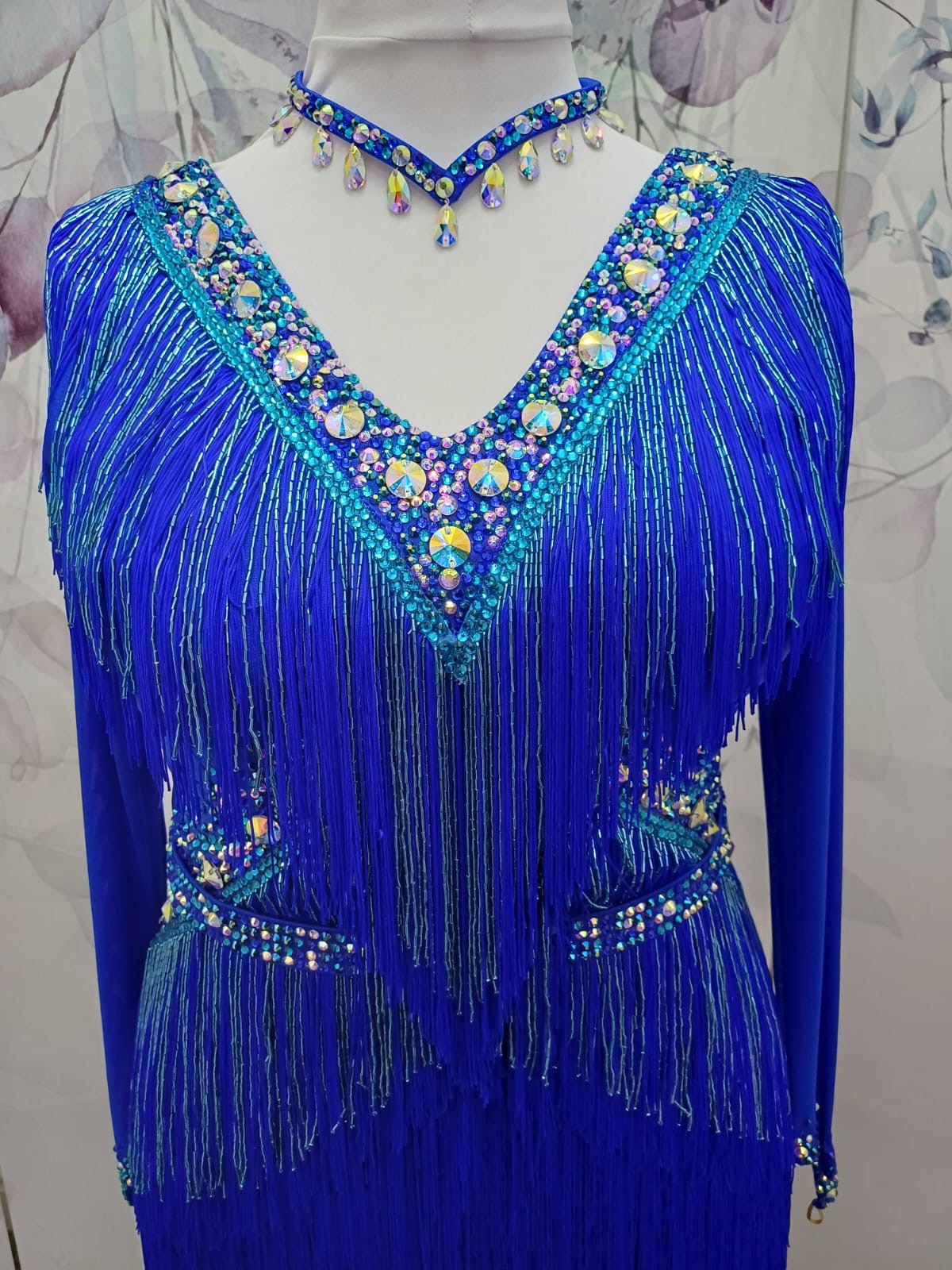 53L Cobalt Blue Competition Latin Dance Dress. Very full fringed skirts with bead droppers to the upper chest & Hip in a contrasting turquoise blue. Heavily stoned in Sapphire & Light Sapphire. ❤️Showroom Appointments Available❤️
