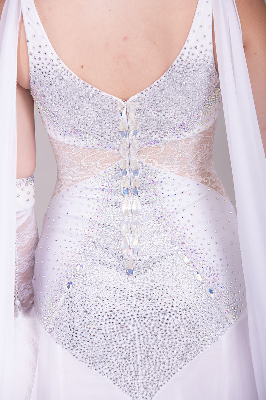 52B TWD “PETITE” Feminine in White with Lace hip inserts Competition Ballroom Dance Dress. Lovely lace Design detail to the upper Bodice. Stoning in AB. Marabou Boa Floats     ❤️Showroom Appointments Available❤️