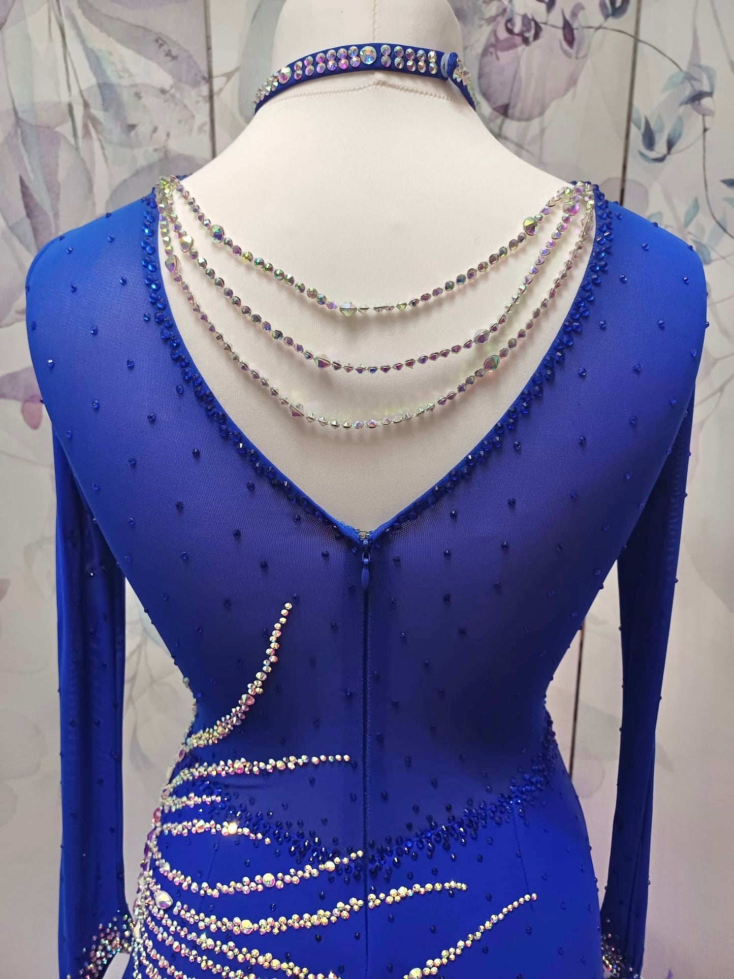 098 Royal Blue Competition Dance Dress. Heavily stoned with AB & Sapphire. Hanging strip details to upper right chest. High back giving option to wear own bra.