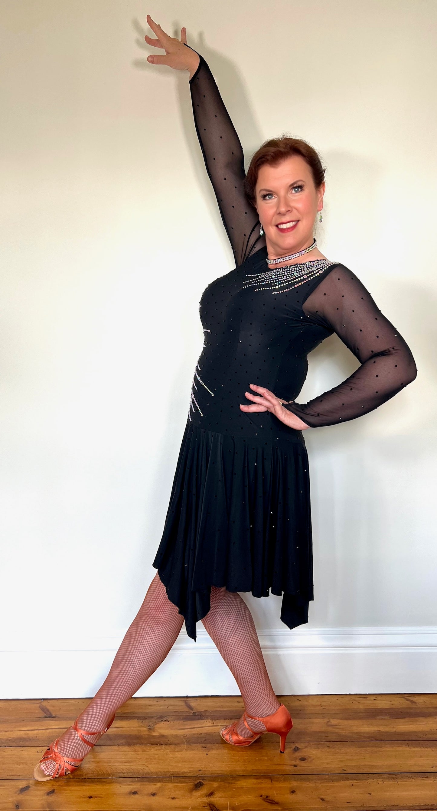 199 Flattering Black Latin Dance Dress. Super Stretchy. Stoned in AB starburst design with handkerchief hem skirt. High back giving option for wearing own bra.