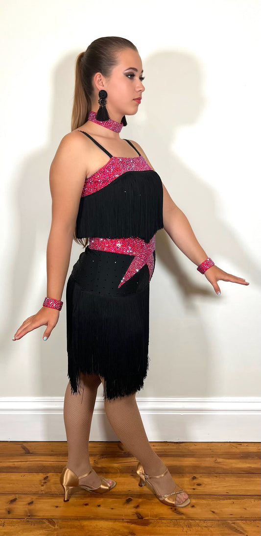 152 Black Latin Dress with full fringe skirt and fringe detailing to the bodice.  Cerise Belt and upper chest panels decorated in Siam AB stones