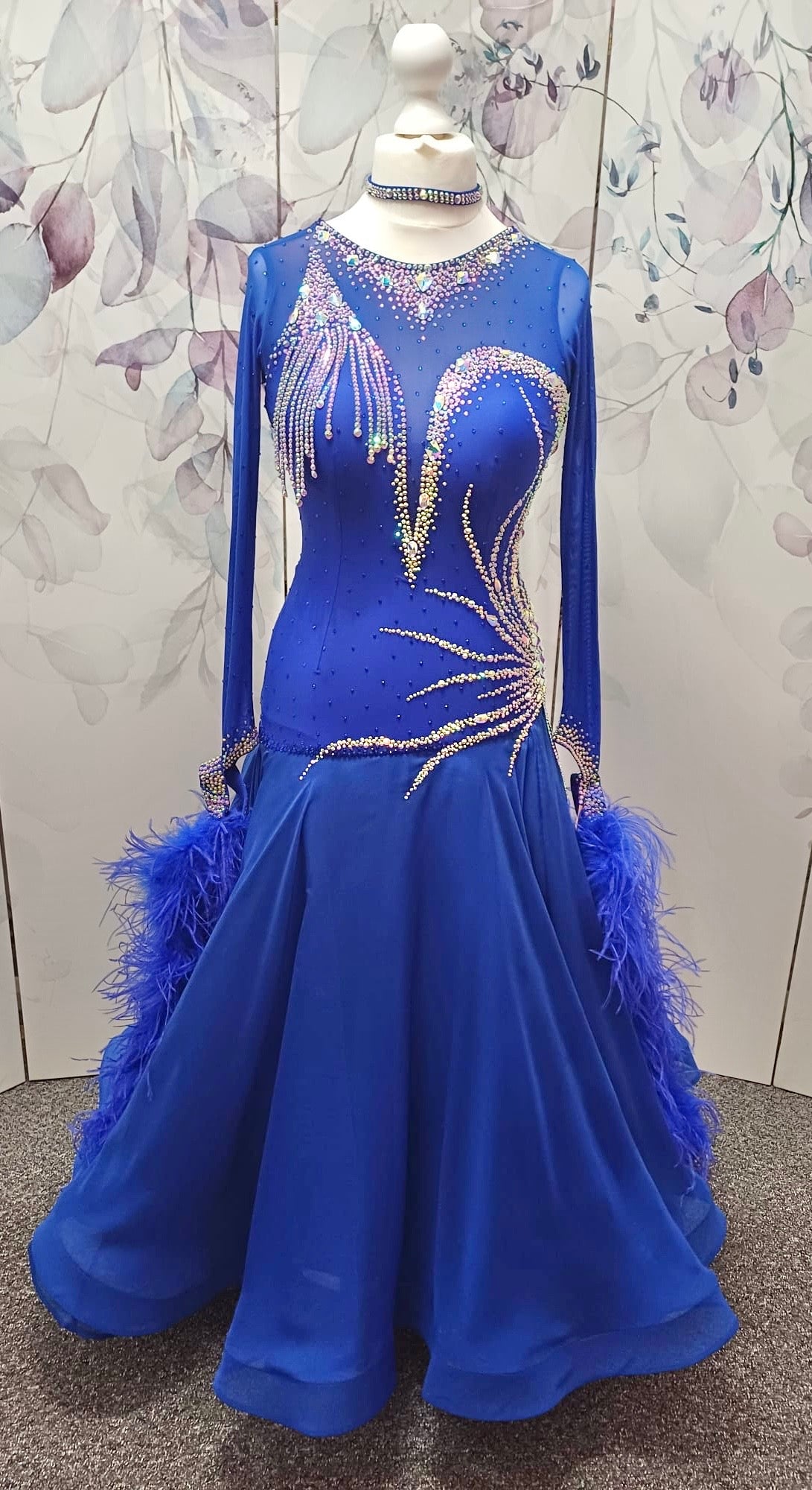 098 Royal Blue Competition Dance Dress. Heavily stoned with AB & Sapphire. Hanging strip details to upper right chest. High back giving option to wear own bra.