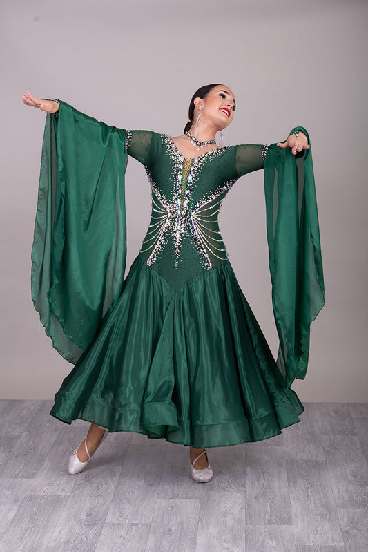 50B 48B TWD “PETITE” Jade Green Competition Ballroom Dance Dress. Beautiful hanging strap detail on the hips. Heavily stoned in AB & Emerald & pearls. Bell sleeves. ❤️Showroom Appointments Available❤️