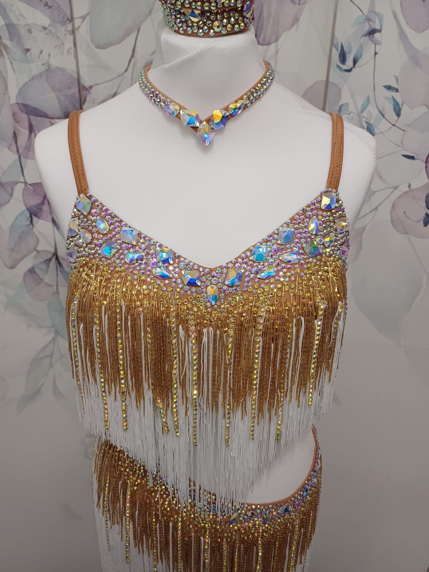 002 White & Gold full fringed Competition Latin Dance Dress. Heavily stoned with Gold & AB. Comes with Armbands & Bracelets. Very full fringes with stoned fabric strips added.