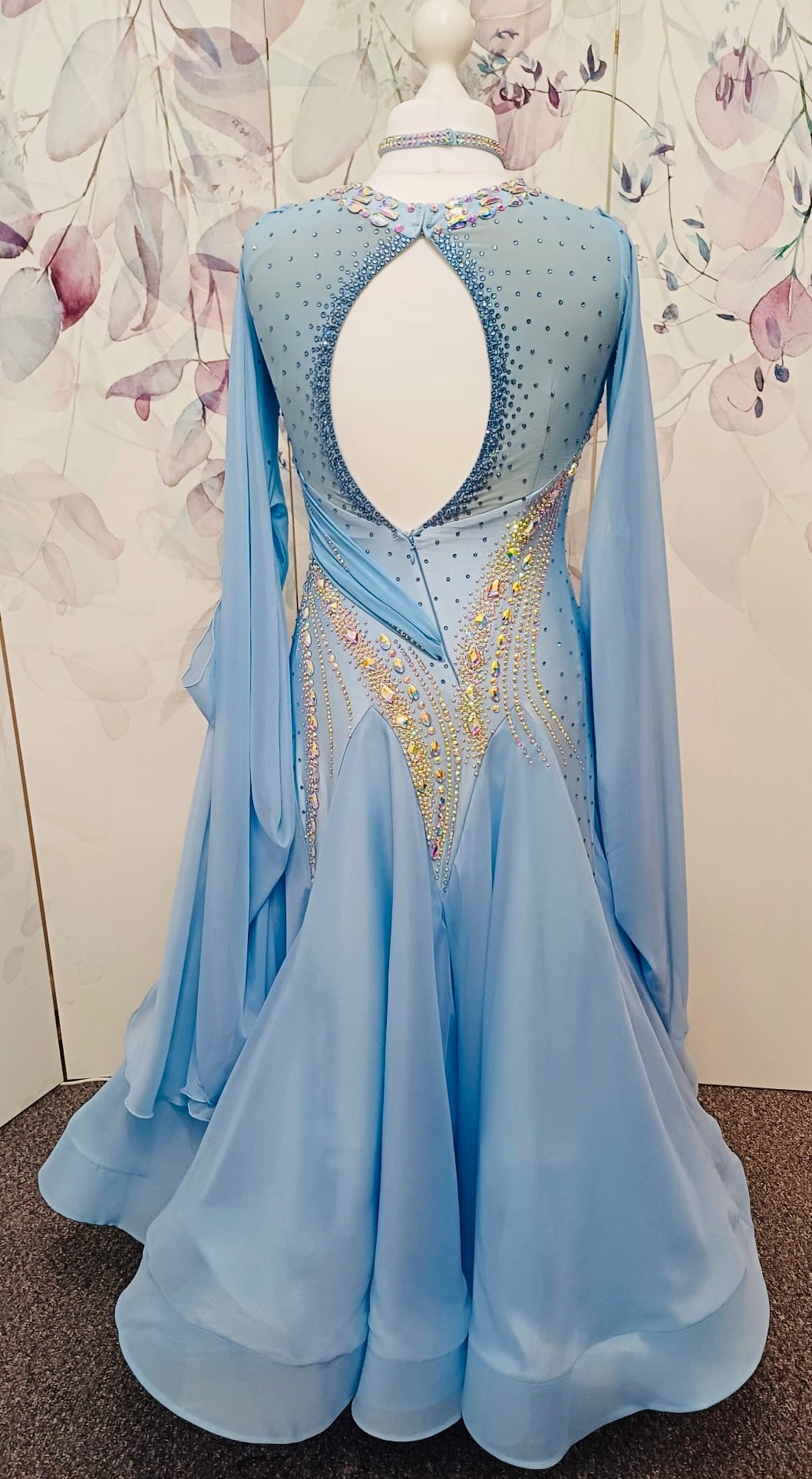 007 Light Blue Competition Ballroom Dance Dress. Heavily stoned in AB & Blue. Mesh overlay to one side of the bust continuing round to the back. Comes with detachable floats.