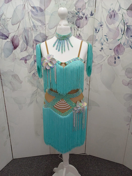 (BUDGET)8 Icey Blue Latin Competition Dance Dress. stoned AB & pearls. Flower to chest & hip, fringe skirts.                                           *****Our New Budget Range are Bought in ready made Costumes, with some detail added by TWDance*****
