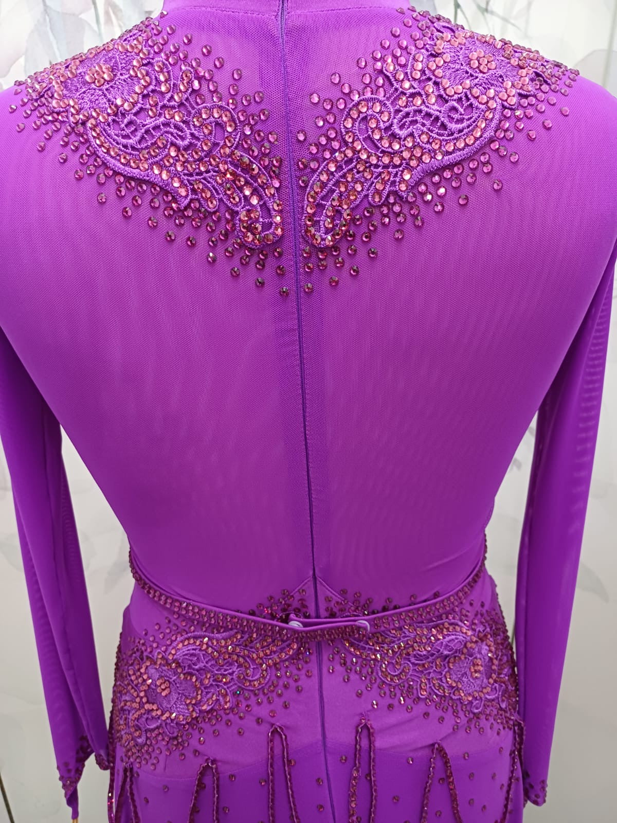 59L Hot Magenta Competition Latin Dance Dress.small split to front left. Very full skirt for maximum movement. High back to allow own bra option. Stunning stoned appliqués Strappy design waist/hip. Stoned in Fuschia & light Rose ❤️Showroom Appointments❤️