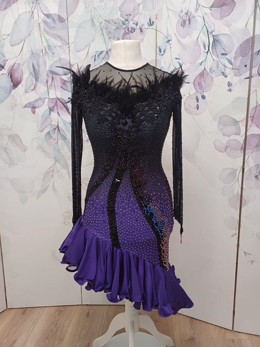1404 Standout Latin Dance Dress. Black to purple ombre with full frill skirt. Decorated with ostrich feather trim, purple & jet stones.