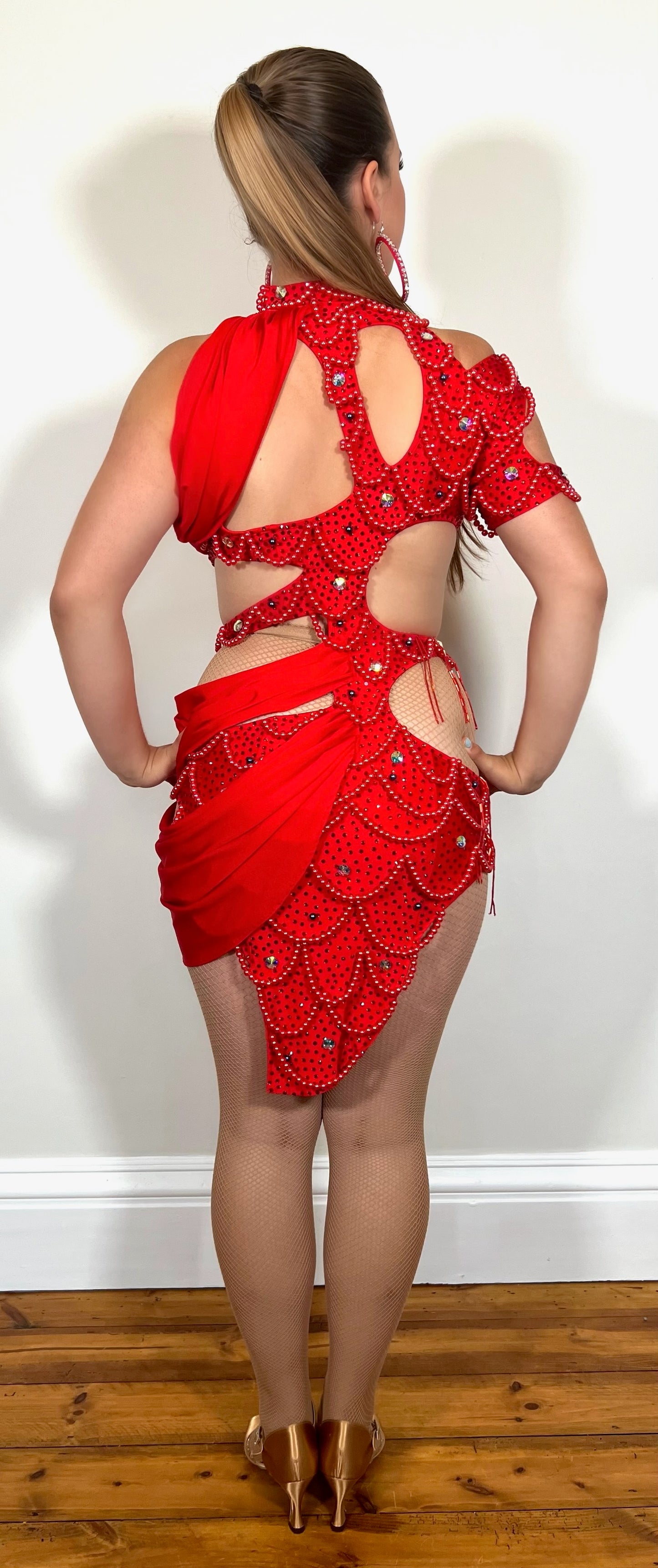 075 Red beaded Latin Dress. Mermaid patterned beaded dress. Cut out design to the back & sides. Multi drapes to one side of the dress