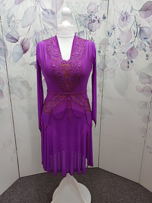 59L Hot Magenta Competition Latin Dance Dress.small split to front left. Very full skirt for maximum movement. High back to allow own bra option. Stunning stoned appliqués Strappy design waist/hip. Stoned in Fuschia & light Rose ❤️Showroom Appointments❤️