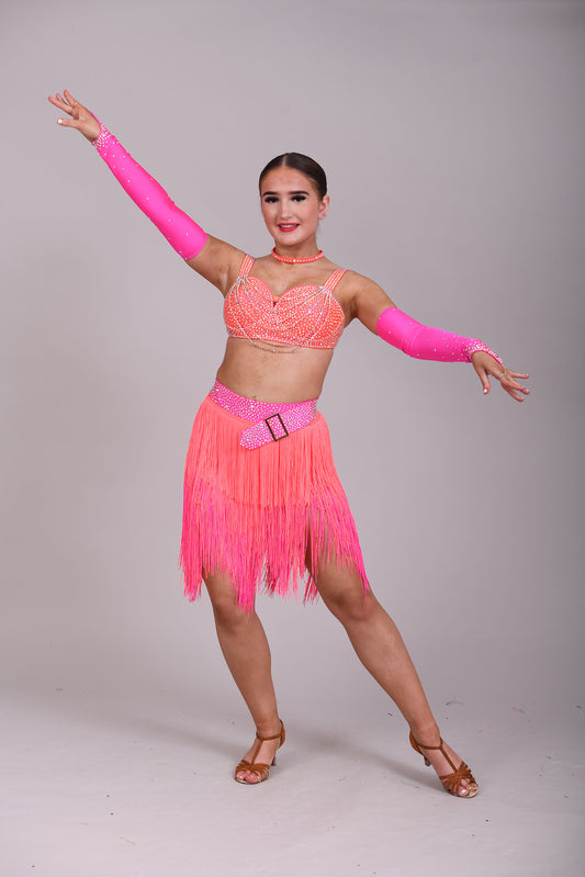 153 Flo Pink & Flo Orange Latin Dance Dress 2 Piece. Comes with separate gloves. Heavily stoned in AB with belt detail to the skirt