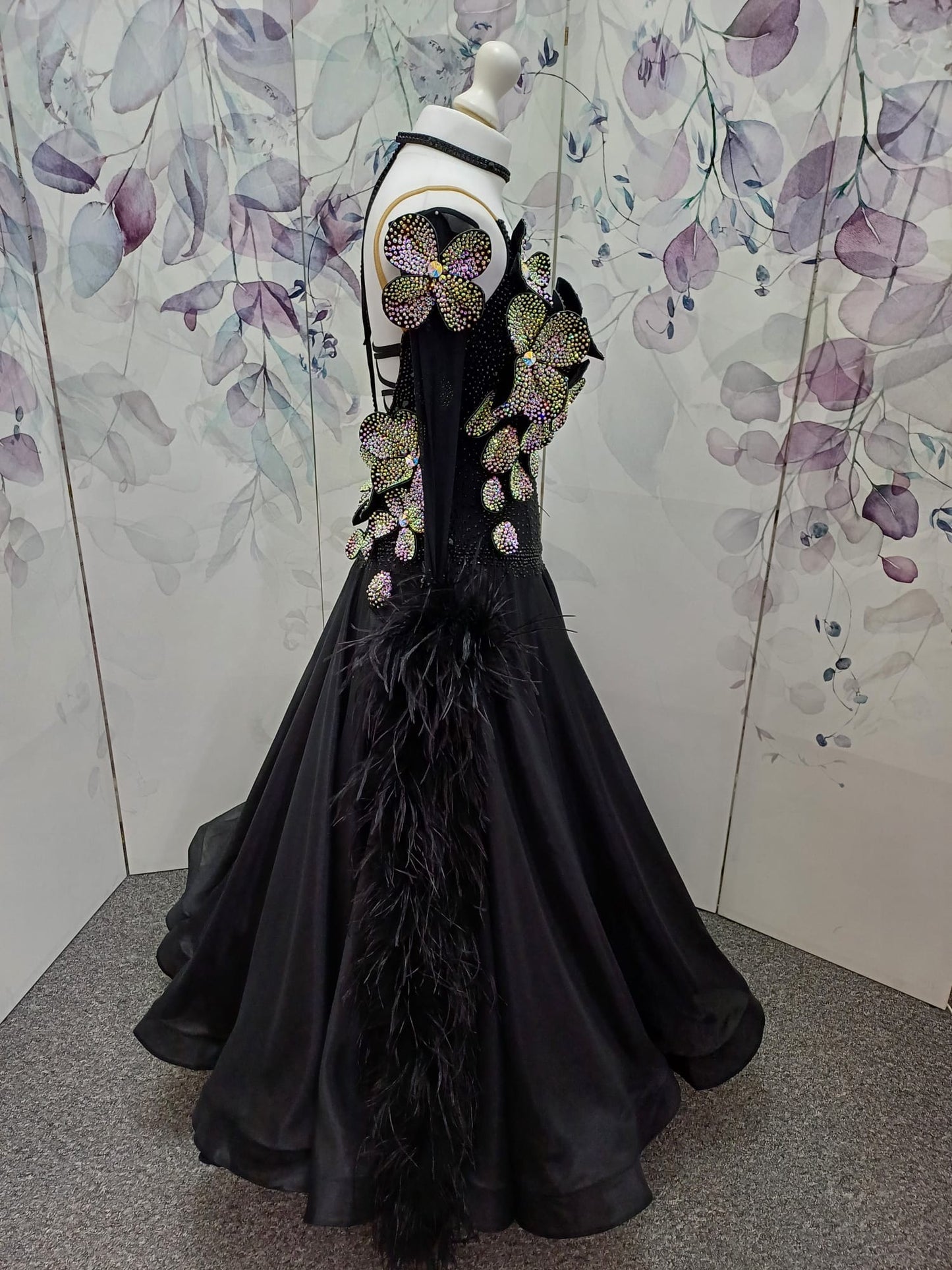 57B TWD “ELITE” Striking Black Ballroom/Sequence Competition Dance Dress. 3D Flowers heavily stoned in AB with Jet stoning throughout. Detachable Ostrich Feather Floats & Long Gloves ❤️Showroom Appointments Available❤️