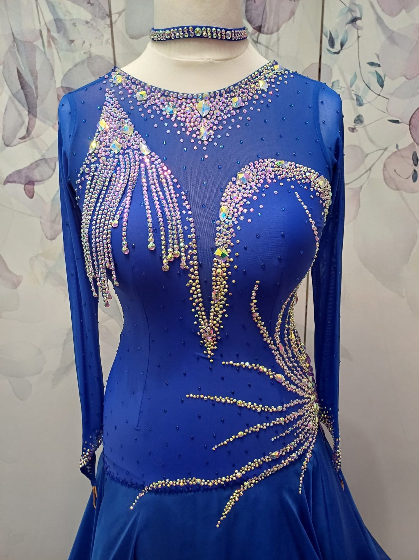 098 Royal Blue Competition Dance Dress. Heavily stoned with AB & Sapphire. Hanging strip details to upper right chest. High back giving option to wear own bra.