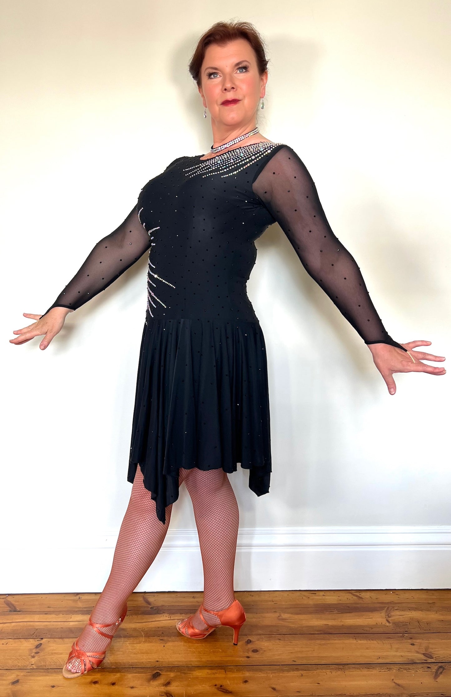 199 Flattering Black Latin Dance Dress. Super Stretchy. Stoned in AB starburst design with handkerchief hem skirt. High back giving option for wearing own bra.