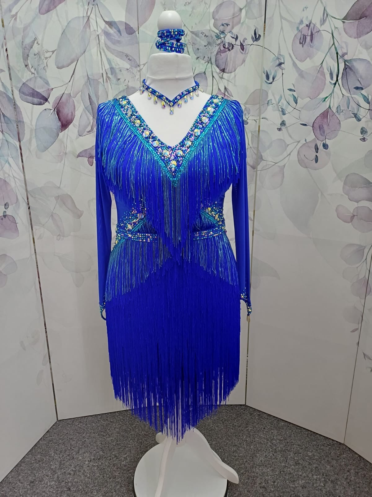 53L Cobalt Blue Competition Latin Dance Dress. Very full fringed skirts with bead droppers to the upper chest & Hip in a contrasting turquoise blue. Heavily stoned in Sapphire & Light Sapphire. ❤️Showroom Appointments Available❤️
