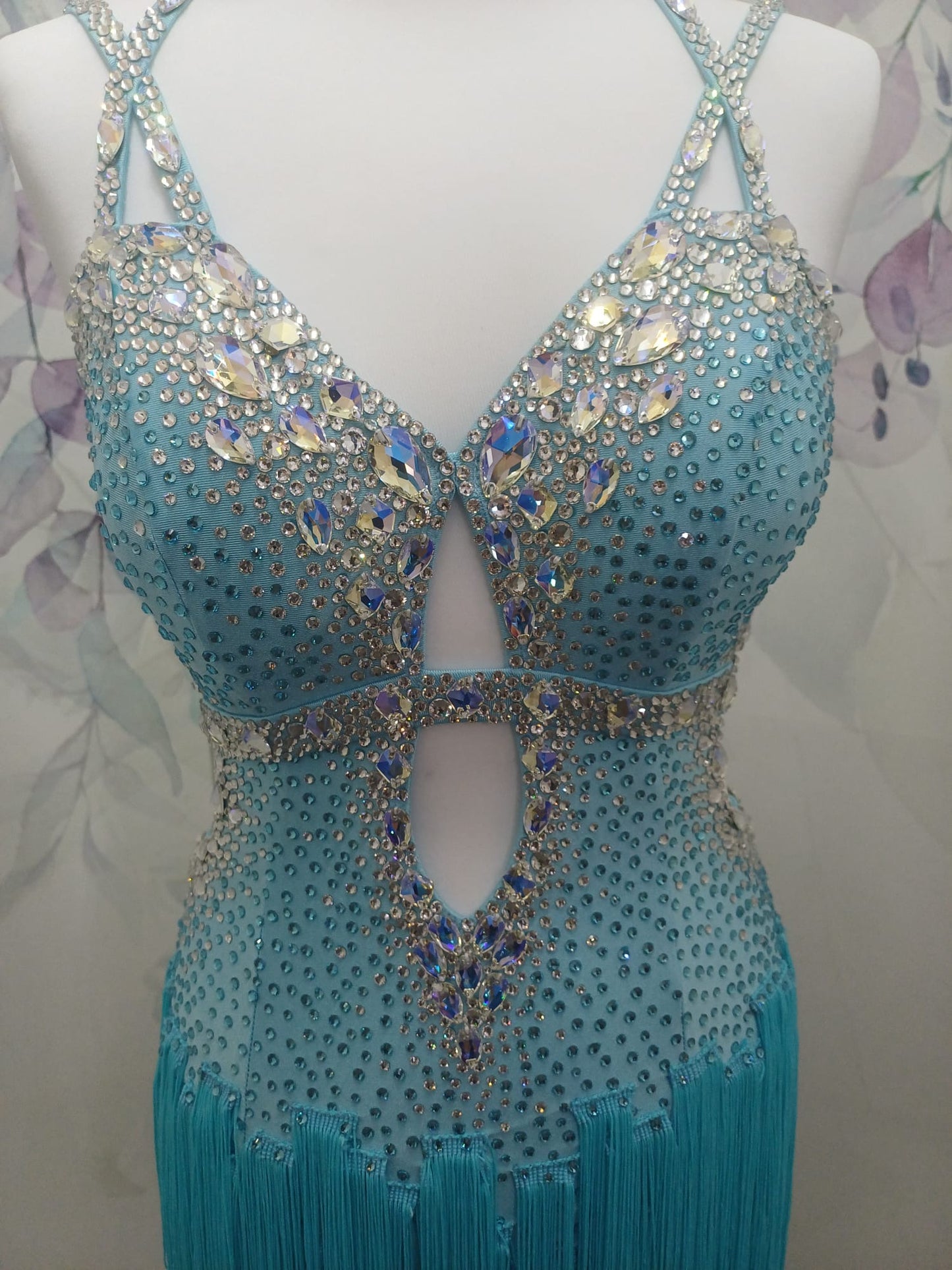 47L Paradise Blue Competition Latin Dance Dress. Beautiful detailing throughout with open design & strap details to the front. Comes with 8 bangles & matching Earrings. ❤️Showroom Appointments Available❤️