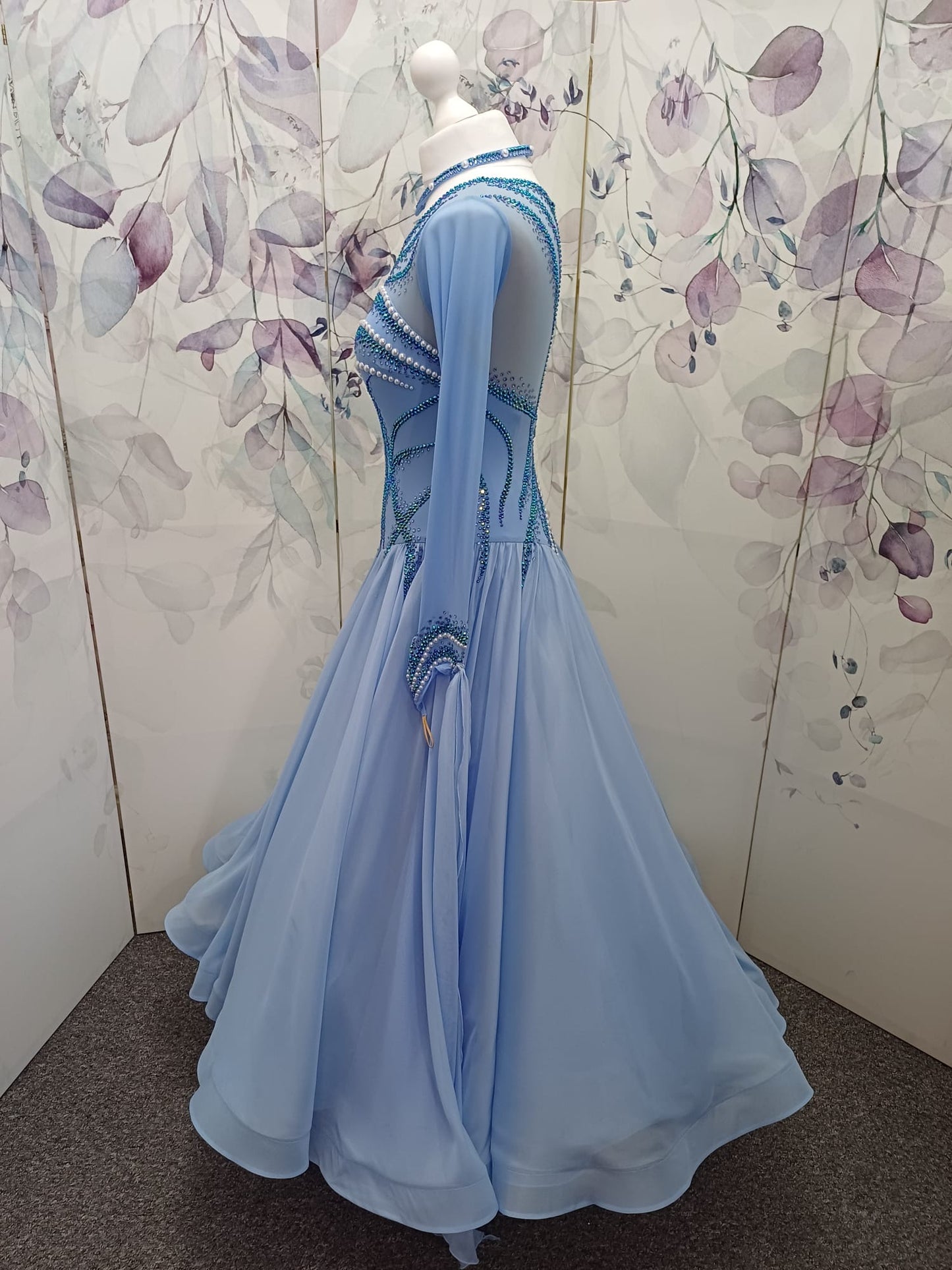 60B TWD ELITE Sky Blue Competition Ballroom/Sequence Dance Dress. New Fuller skirts & Underskirts. Beautiful patterning in Light Sapphire, AB & Light Sapphire AB with White Pearls. Narrow keyhole back. Detachable floats.❤️Showroom Appointments Available❤️