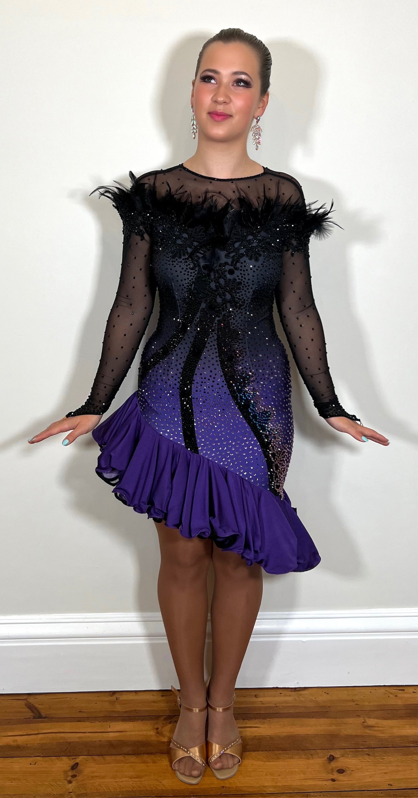 194 Standout Latin Dance Dress. Black to purple ombre with full frill skirt. Decorated with ostrich feather trim, purple & jet stones.