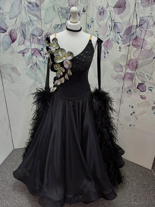 57B TWD “ELITE” Striking Black Ballroom/Sequence Competition Dance Dress. 3D Flowers heavily stoned in AB with Jet stoning throughout. Detachable Ostrich Feather Floats & Long Gloves ❤️Showroom Appointments Available❤️