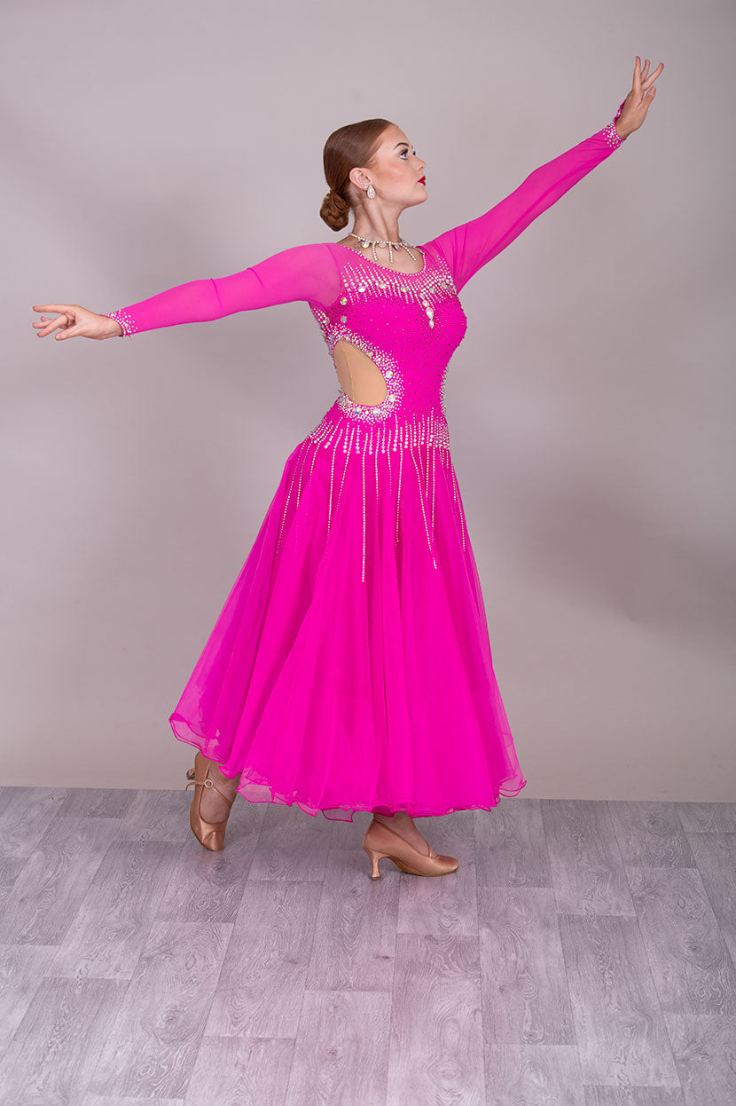 00002 Fuchsia Pink flesh side panel Ballroom Dress. AB stoned material droppers from the waist stoned with Ab throughout