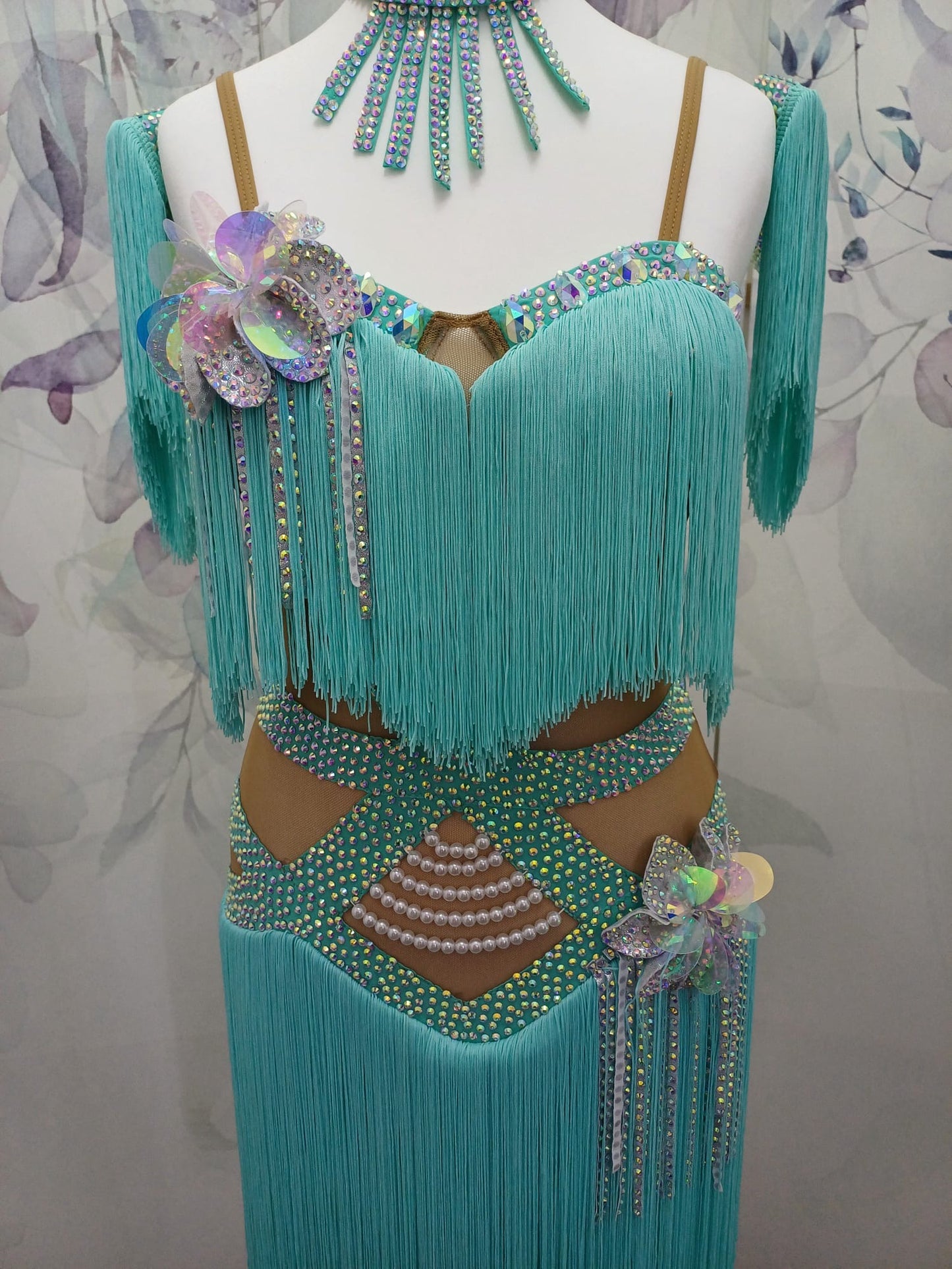 (BUDGET)8 Icey Blue Latin Competition Dance Dress. stoned AB & pearls. Flower to chest & hip, fringe skirts.                                           *****Our New Budget Range are Bought in ready made Costumes, with some detail added by TWDance*****