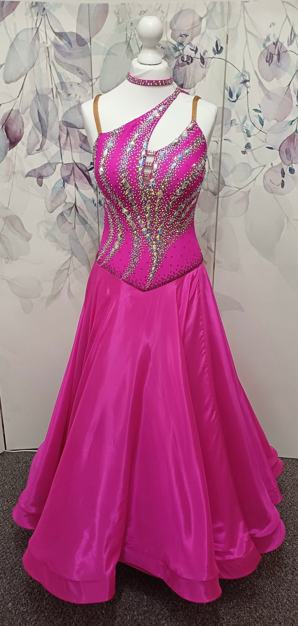 005 Cerise Pink Competition Ballroom Dance Dress. Heavily stoned in AB and Fuchsia & lilac. Comes with ostrich cuffs in Lilac & Cerise. Beautiful back detail.