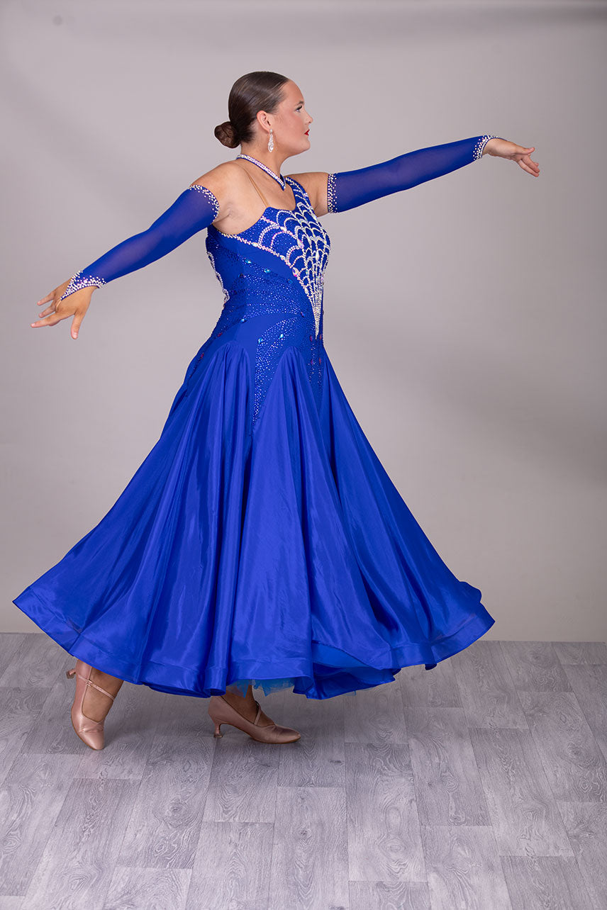 34B “TWD ELITE” Ballroom/Sequence Competition Dance Dress New Fuller Skirts & Underskirts. Striking Royal Blue Dress with web design in AB and Sapphire stoning on the bodice. Beautiful back detail with separate gloves


❤️Showroom Appointment Available❤️