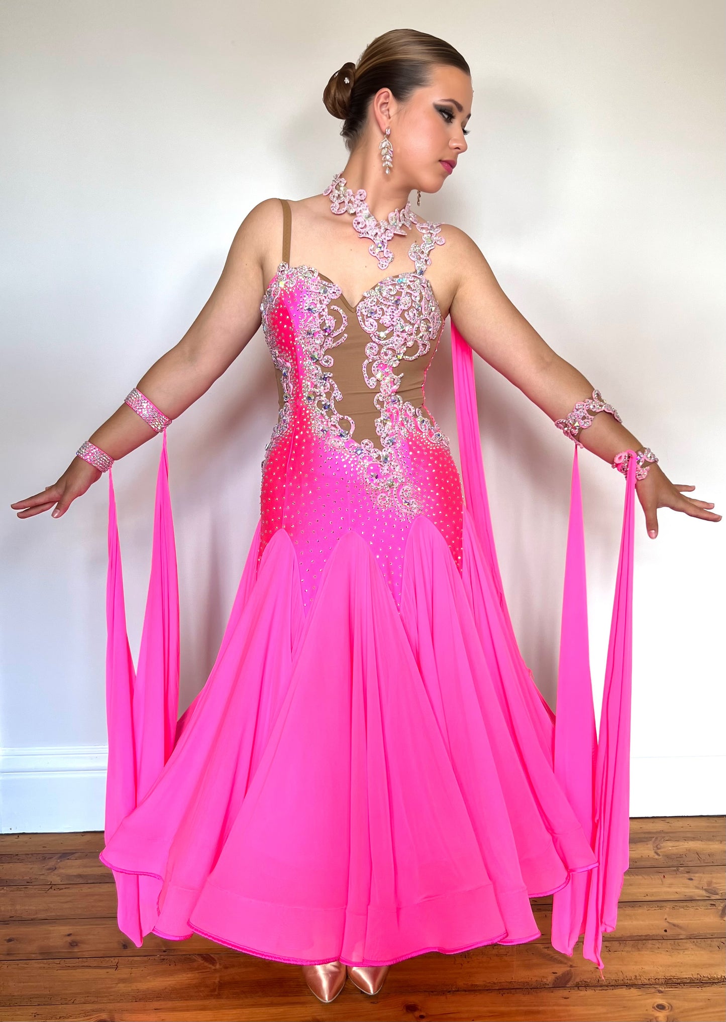 033 Hot Flo Pink heavily decorated Ballroom Dress. Heavily stoned in AB with open back. Comes with a lot of accessories, bands & floats.