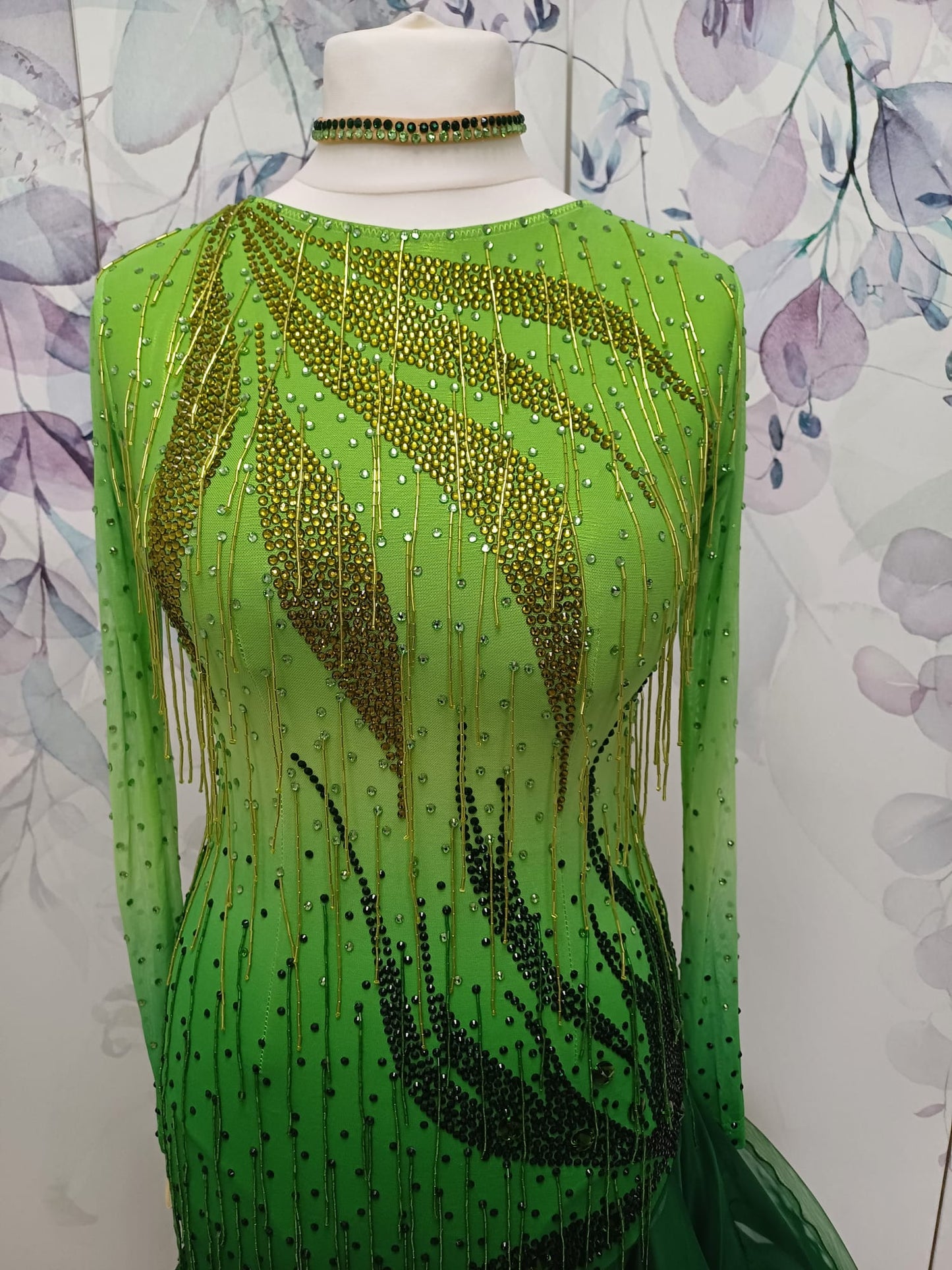 125 Apple Green Ombre Latin dress. Chiffon skirts edged in crinoline. Stoned in Peridot, Olivine & Emerald. Includes Hold droppers to the front area with a mesh filled in back.
