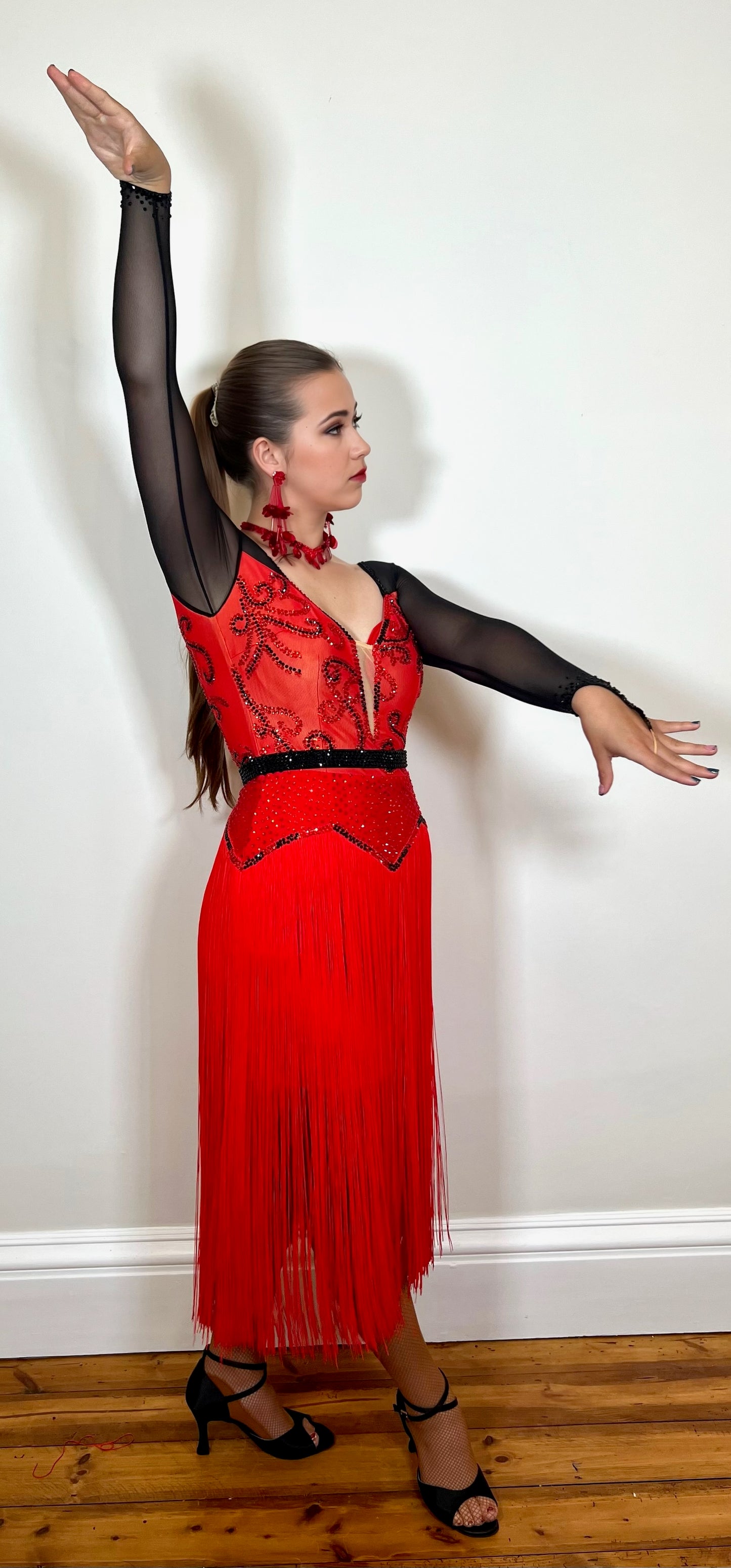 251 Red fitted bodice Latin Dress with red long fringed skirt decorated in jet & Siam stones & detachable belt in jet
