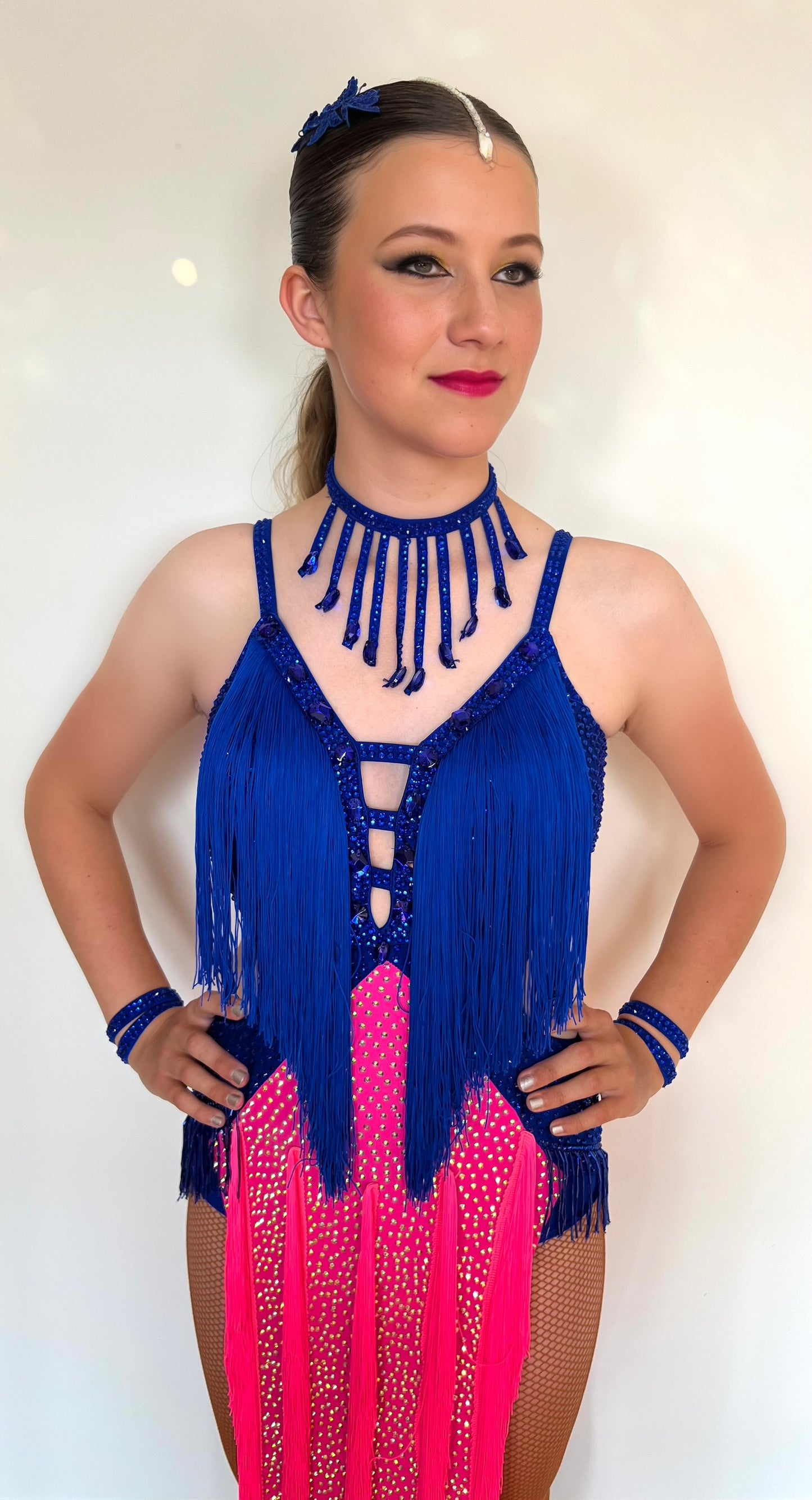 200 Flo Pink and Bright royal blue fringed Latin dress. Decorated in light rosé & sapphire stones