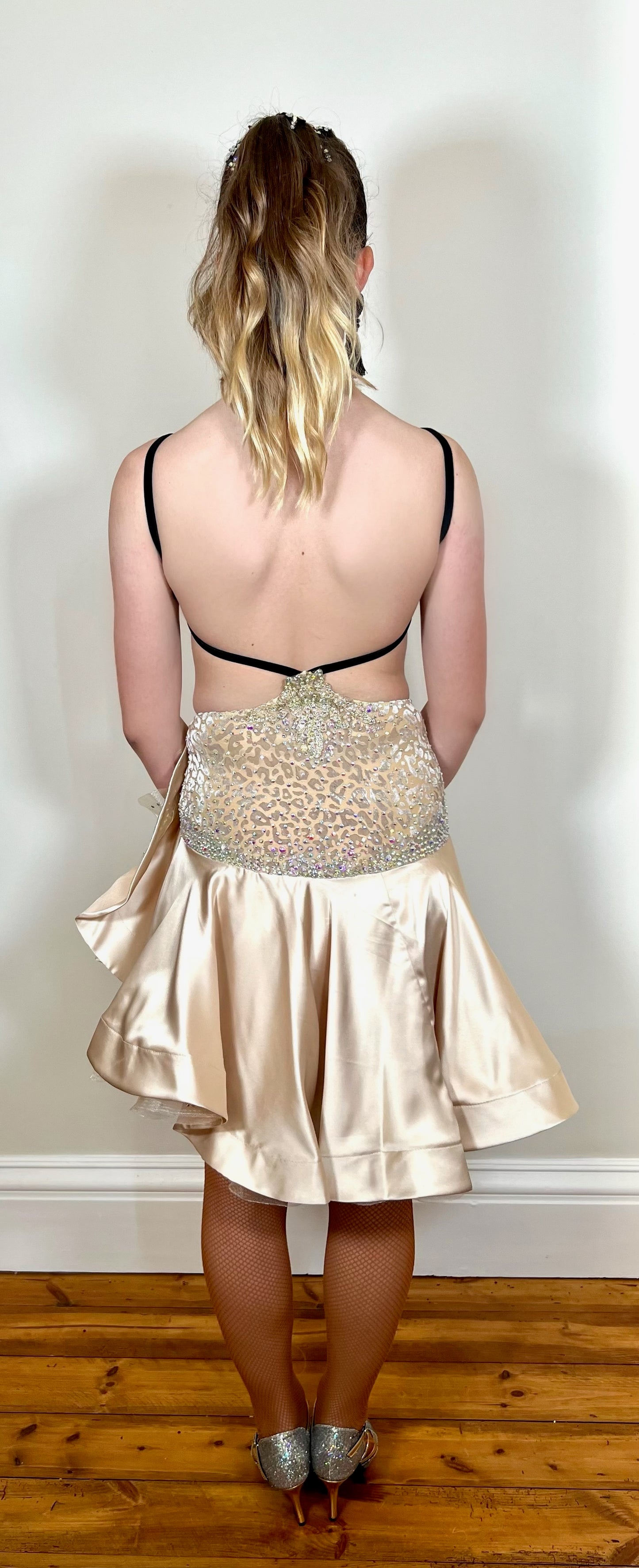 175 Champagne flick Leopard fabric Latin dress. Soft satin skirt with motif detailing to one hip. Gold appliqué with AB stones