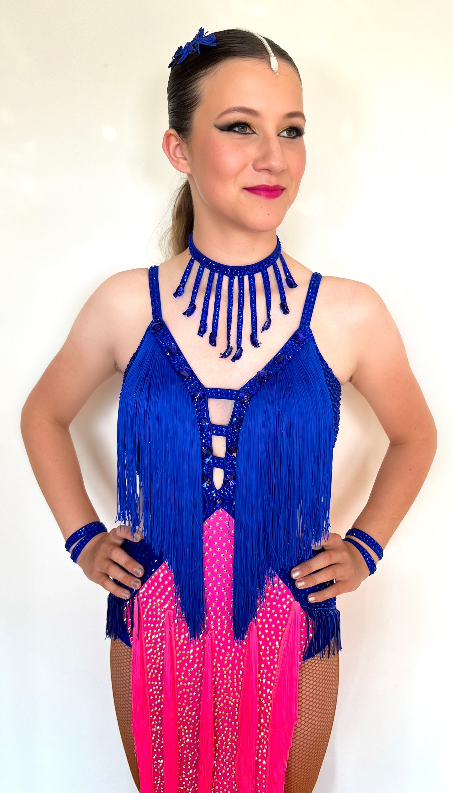 200 Flo Pink and Bright royal blue fringed Latin dress. Decorated in light rosé & sapphire stones