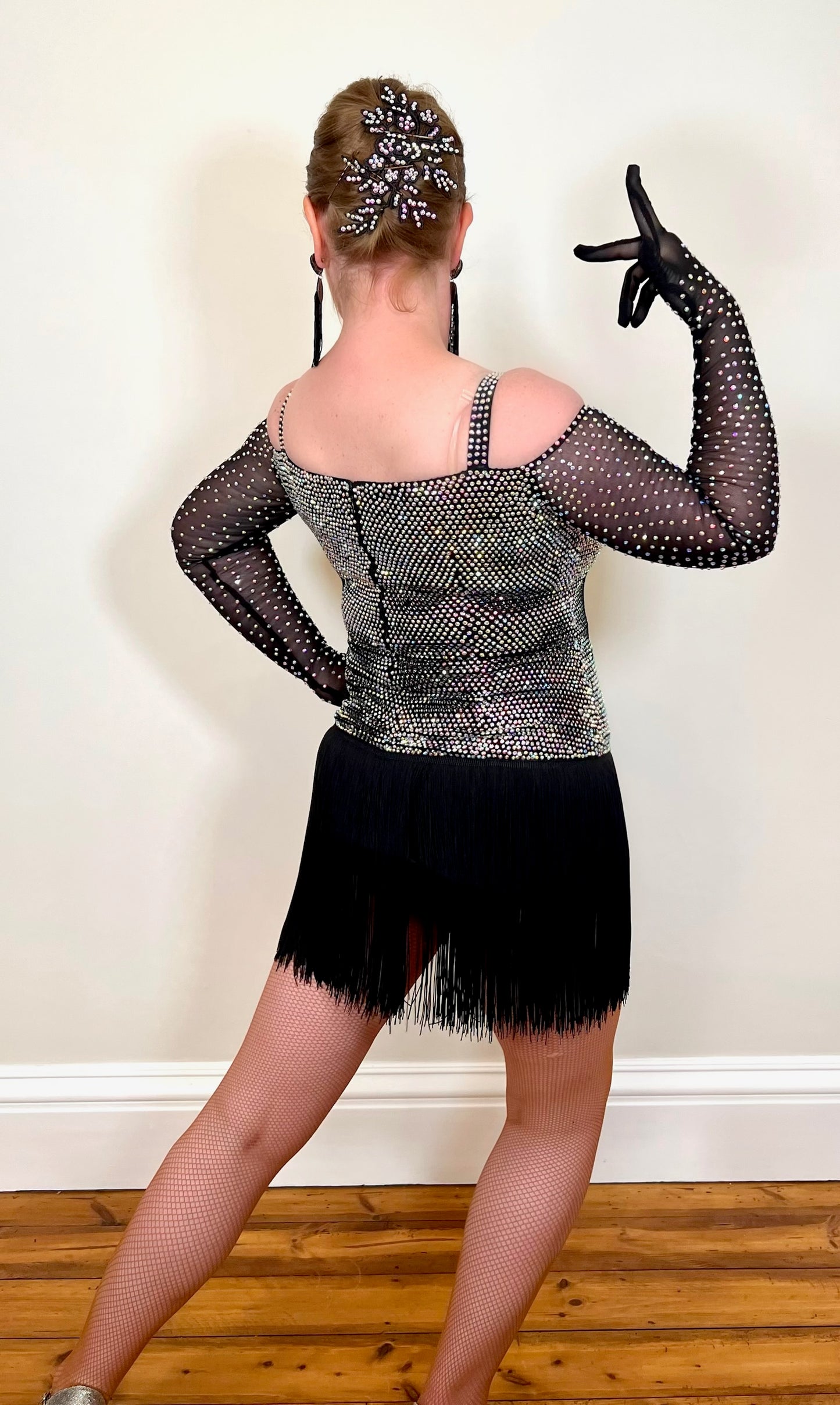 250 Black fringed skirt Latin dress. Solid AB stoning to bodice with cold shoulder black mesh stoned fingered sleeves