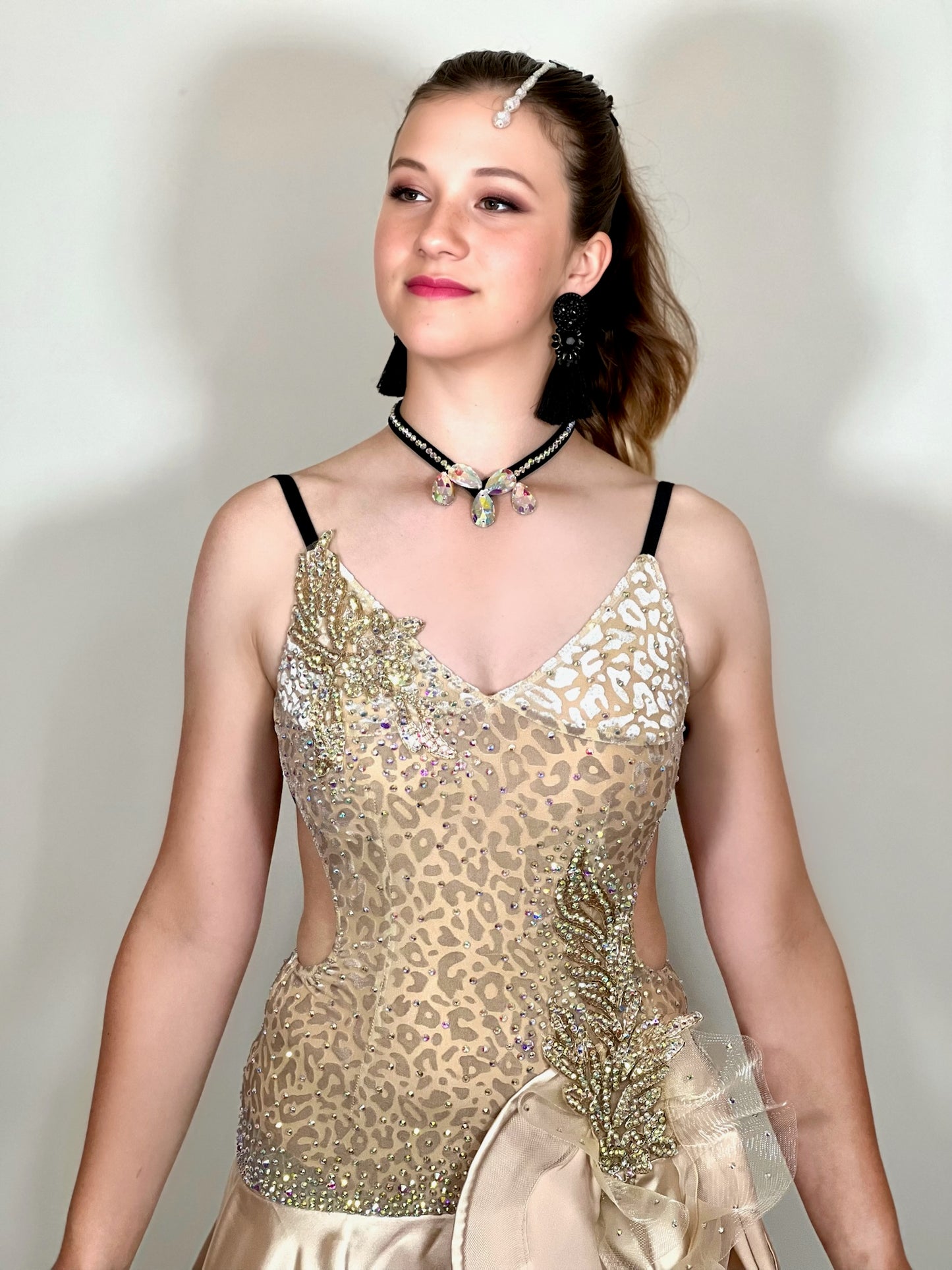 175 Champagne flick Leopard fabric Latin dress. Soft satin skirt with motif detailing to one hip. Gold appliqué with AB stones