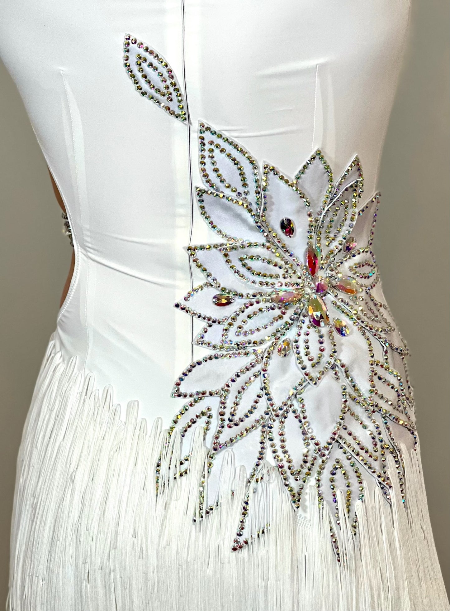 177 White 3D flower & leaf design Latin dress. Fringe skirt with open side detail. Stones all AB