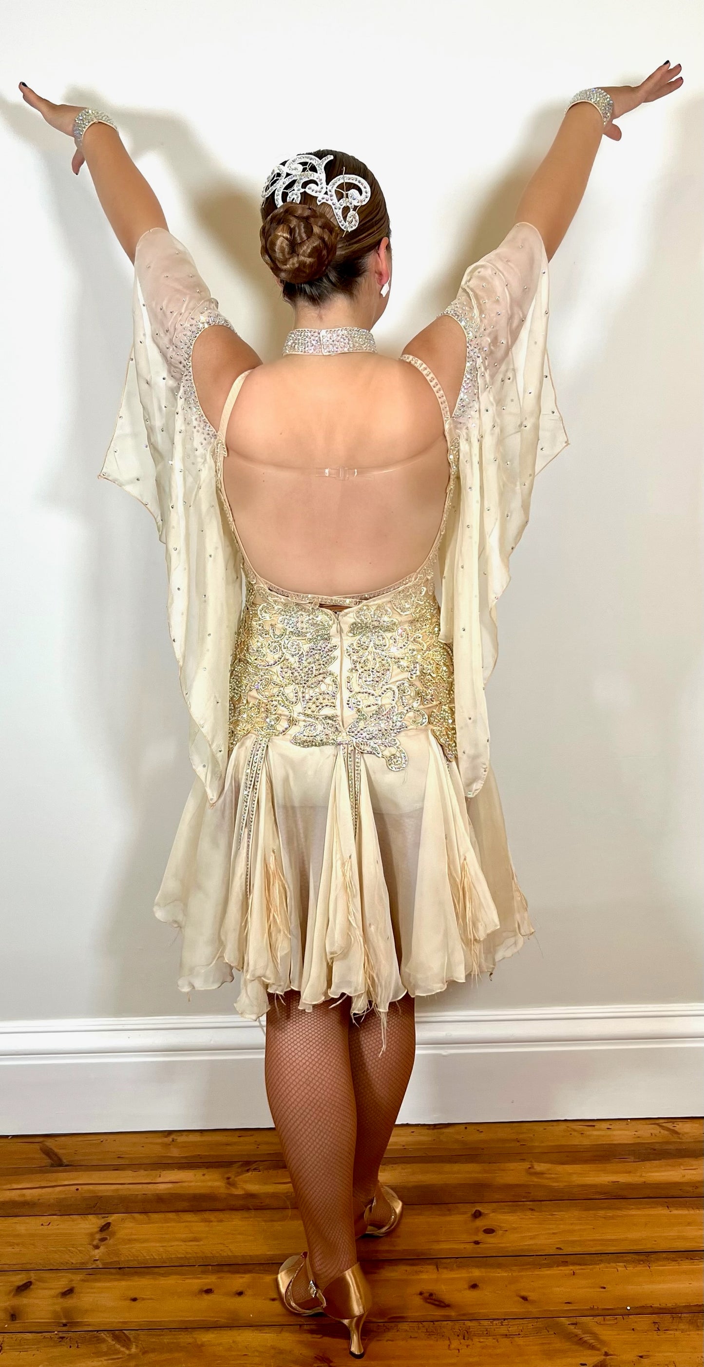 210 Champagne Latin dress fully decorated in champagne motifs & stones. Chiffon skirt with godets & ostrich feather detail