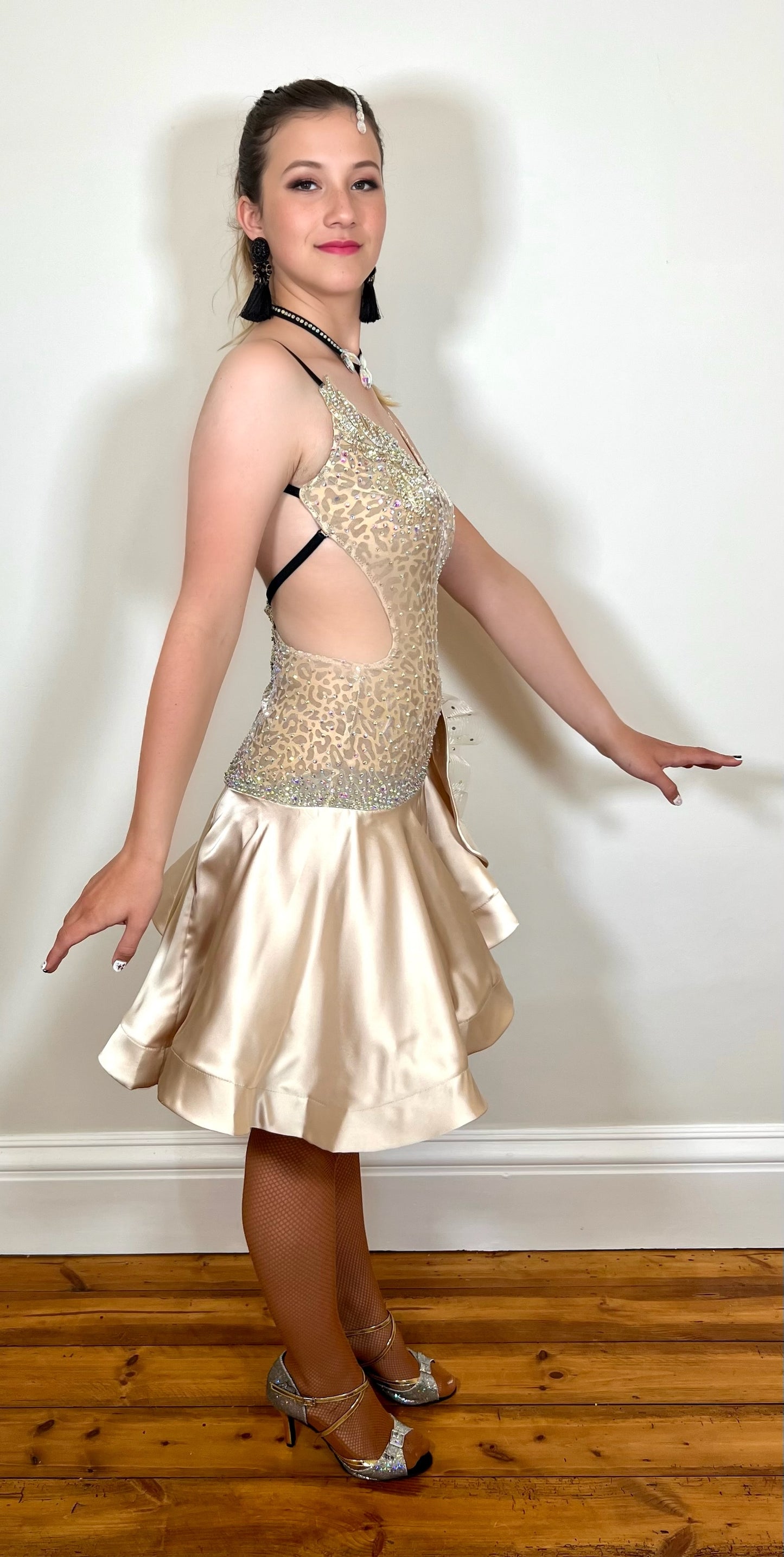 175 Champagne flesh Leopard fabric Latin dress. Soft satin skirt with motif detailing to one hip. Gold appliqué with AB stones