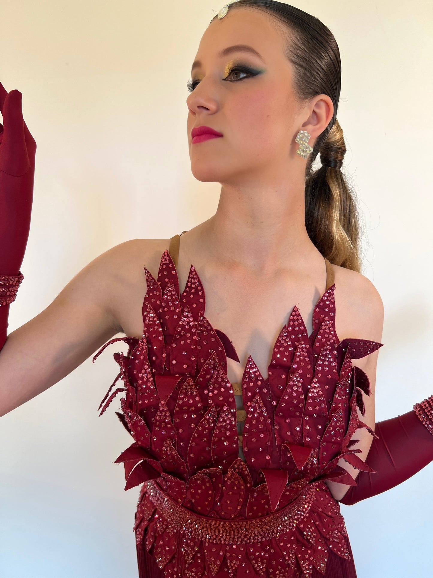 296 Bright Wine 3D detailing dress with fringed skirt. Matching gloves all decorated in matching stones.