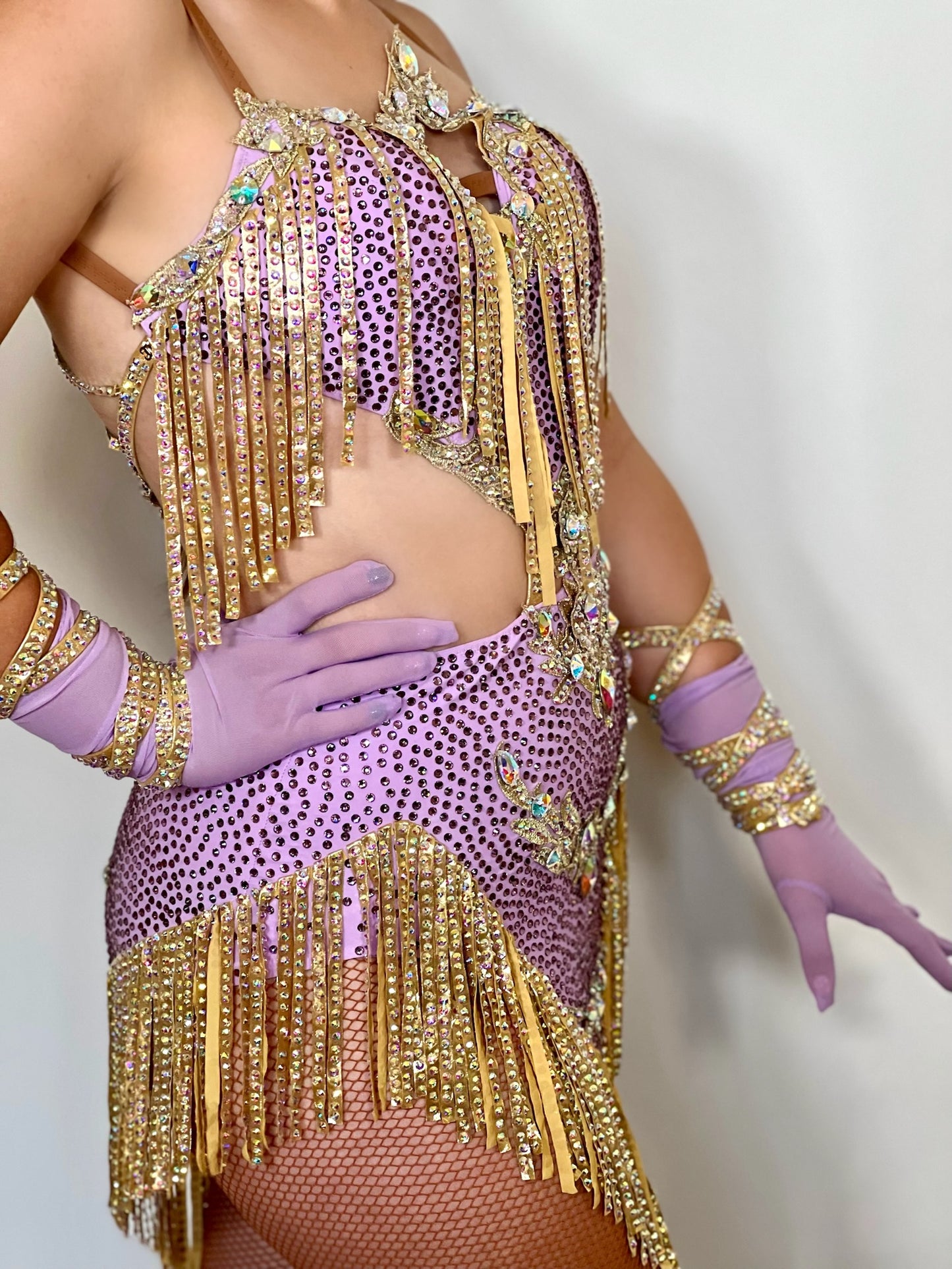 295 Lilac and Gold Latin dress. Gold material droppers stoned in AB. Lilac fabrics all decorated in matching stones.