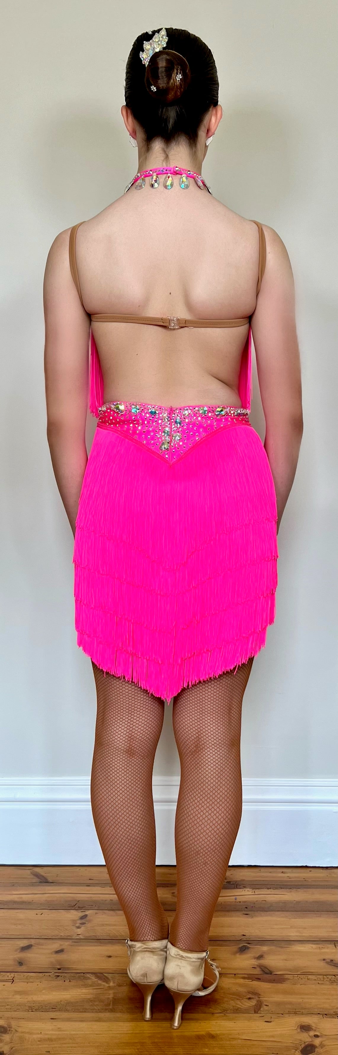 303 Flo Pink Latin Dress. Full fringed skirt decorated in AB Stones & open back detail