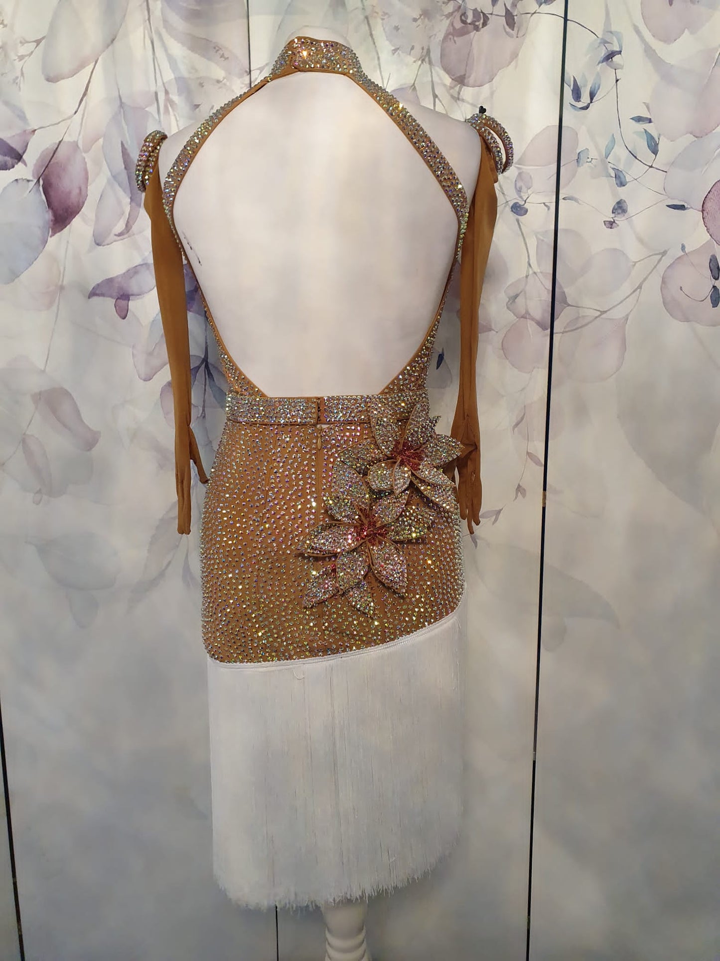299 Tan & white Latin Dress. 3D flower detailing with white fringe skirt. AB & Rose stoning with separate belt.