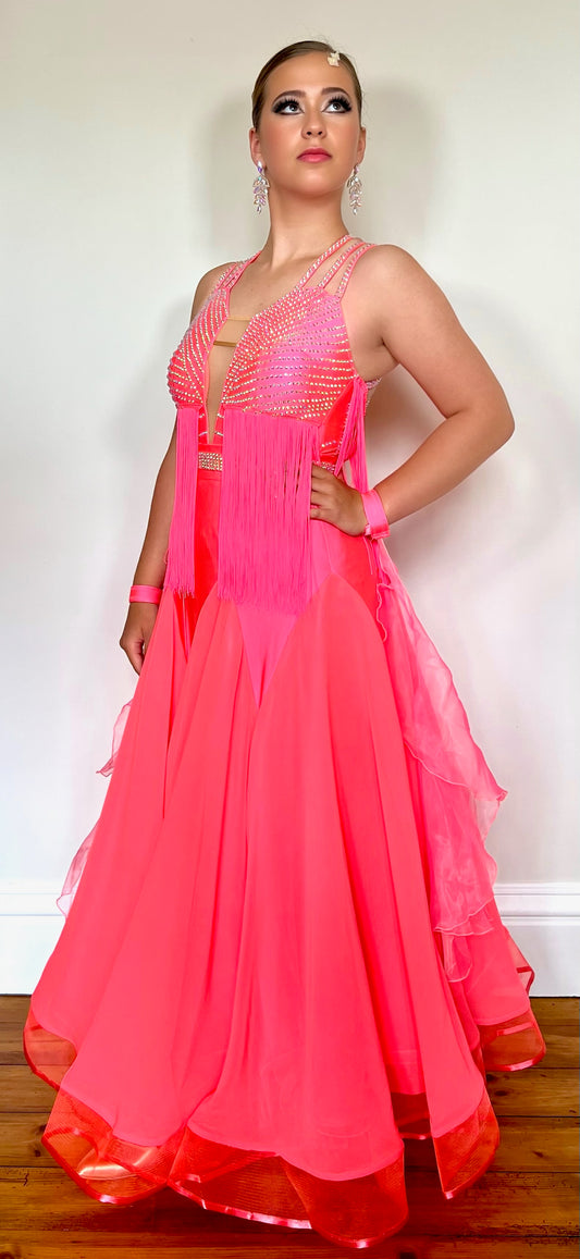 237 Bright Coral Fringed Dress. Decorated in AB stones with strapping detail to the shoulders & back. Matching Skirt, Floats & Belt available on request £135 extra