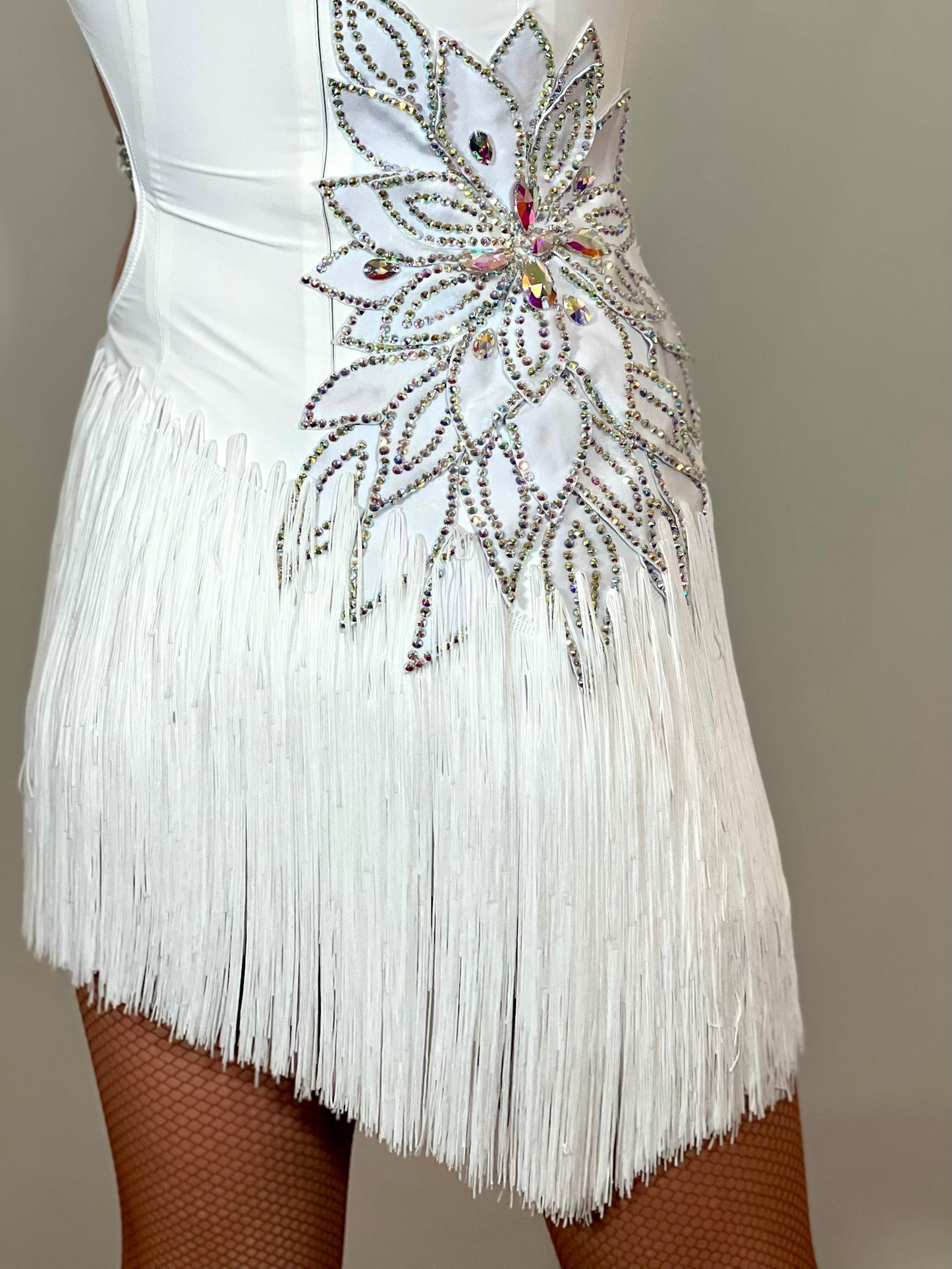 177 White 3D flower & leaf design Latin dress. Fringe skirt with open side detail. Stones all AB