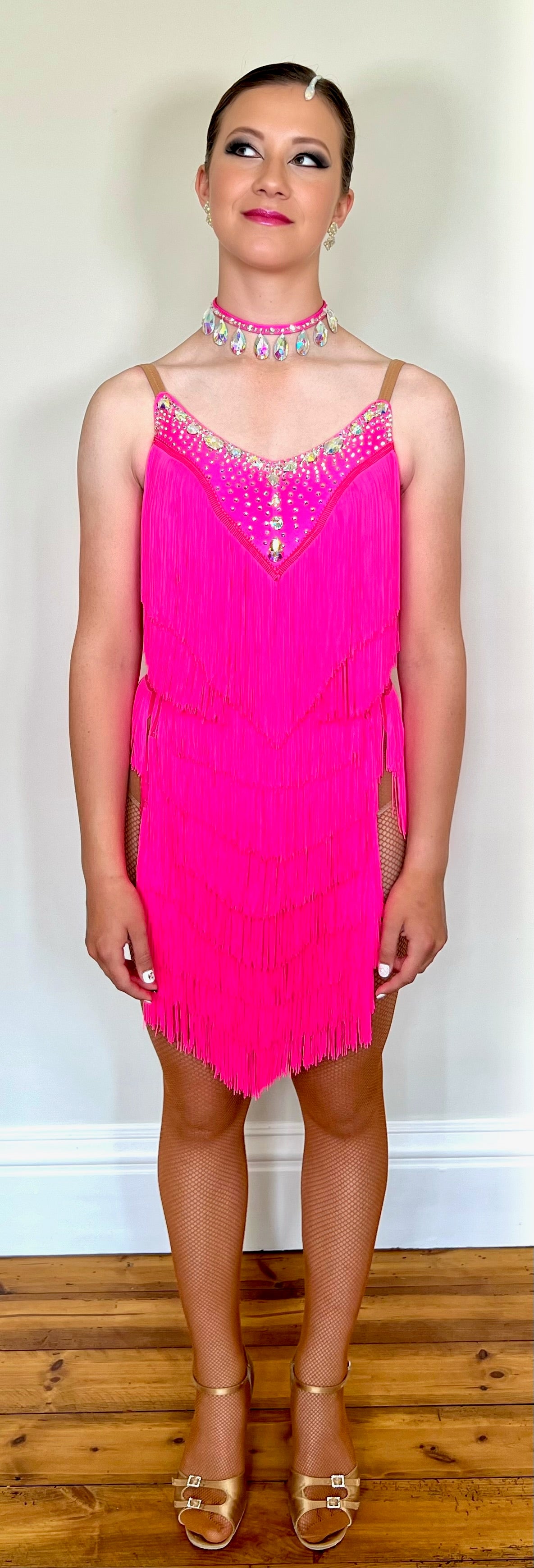 303 Flo Pink Latin Dress. Full fringed skirt decorated in AB Stones & open back detail