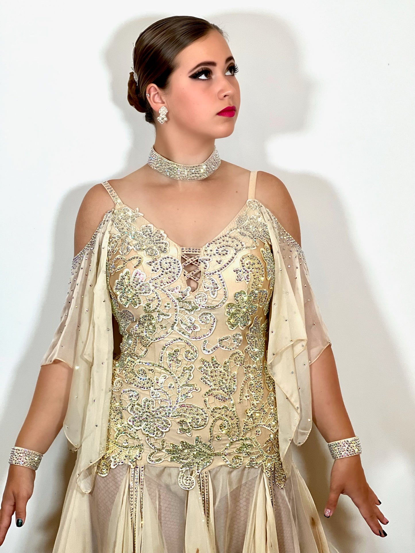 210 Champagne Latin dress fully decorated in champagne motifs & stones. Chiffon skirt with godets & ostrich feather detail