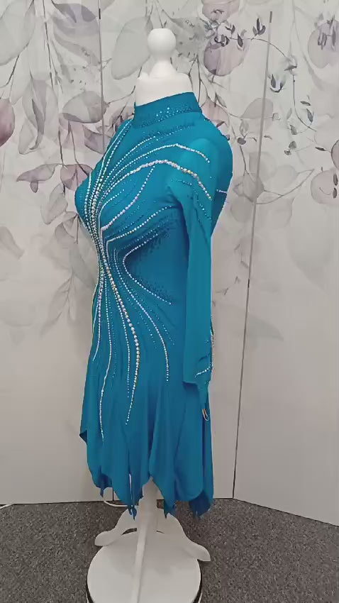 053 Turquoise Competition Latin Dance Dress. Full Handkerchief Hem for maximum movement. Stoned in AB, Pearls, Blue Zircon & Blue AB. High Back to allow option of wearing own Bra